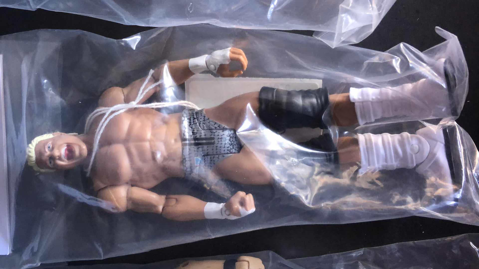 Photo 3 of ASSORTMENT OF UNBOXED WRESTLING ACTION FIGURES (4)