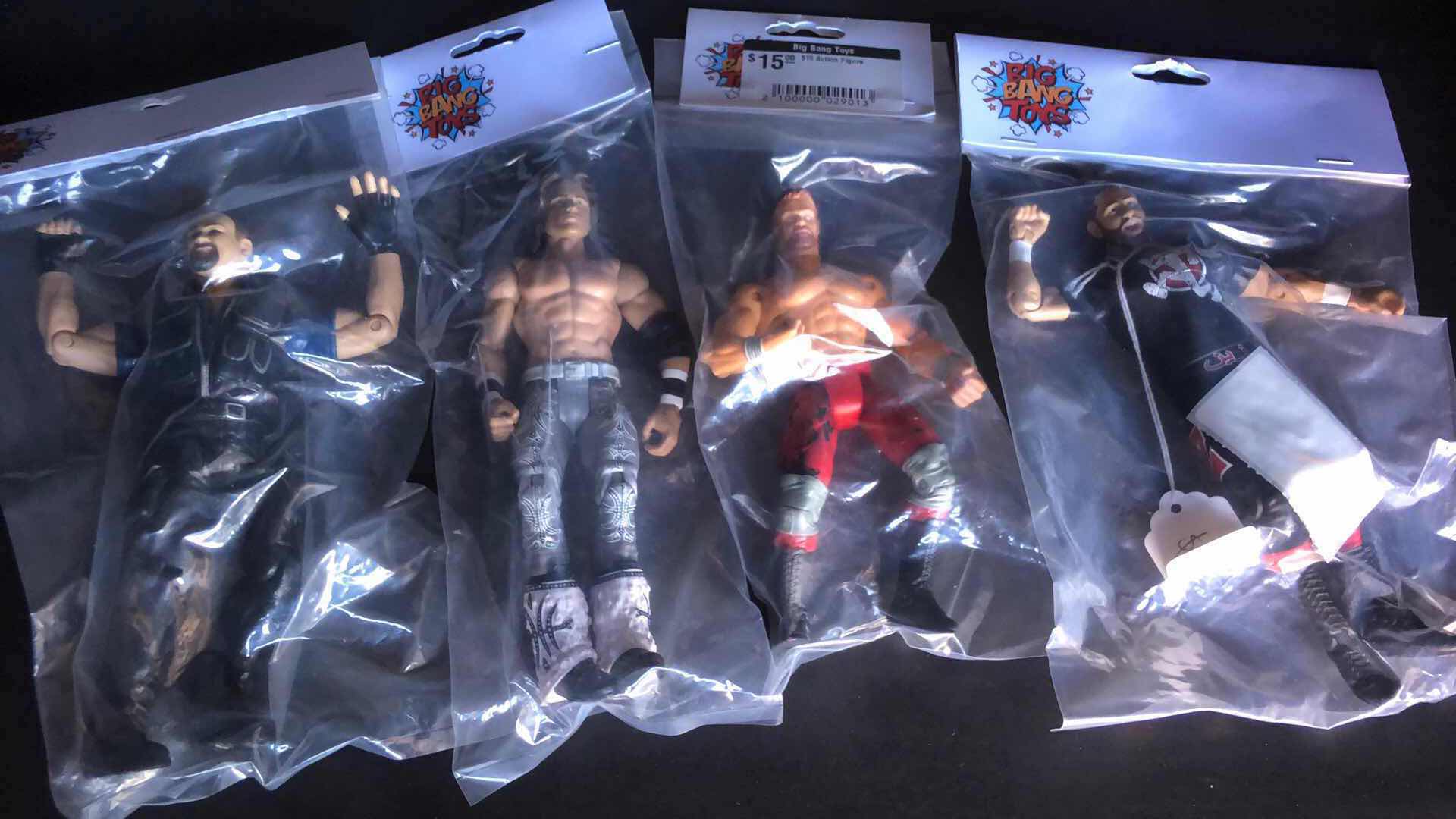 Photo 1 of ASSORTMENT OF UNBOXED WRESTLING ACTION FIGURES (4)