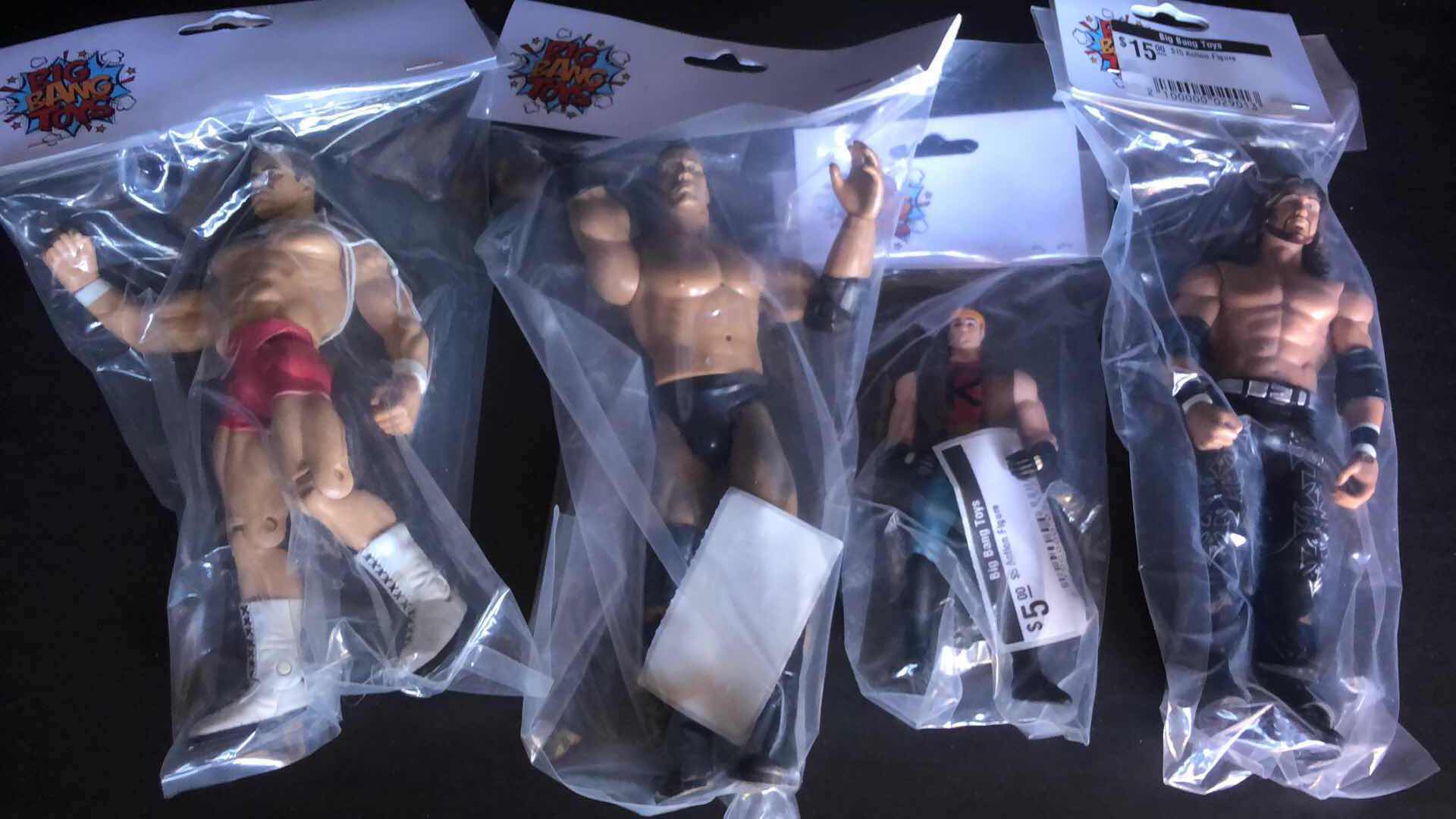 Photo 1 of ASSORTMENT OF UNBOXED WRESTLING ACTION FIGURES (4)