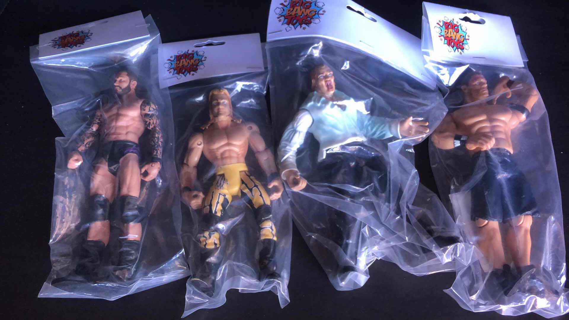 Photo 1 of ASSORTMENT OF UNBOXED WRESTLING ACTION FIGURES (4)