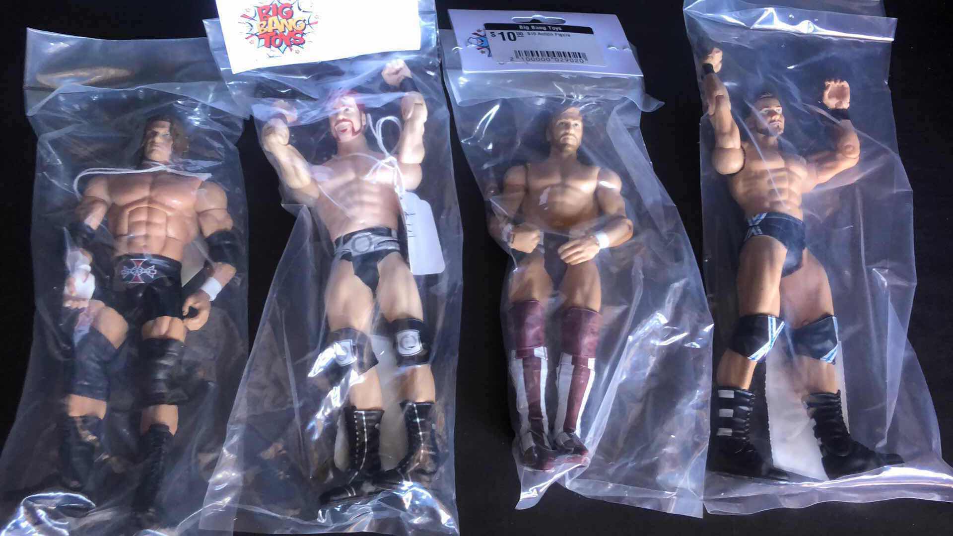 Photo 1 of ASSORTMENT OF UNBOXED WRESTLING ACTION FIGURES (4)