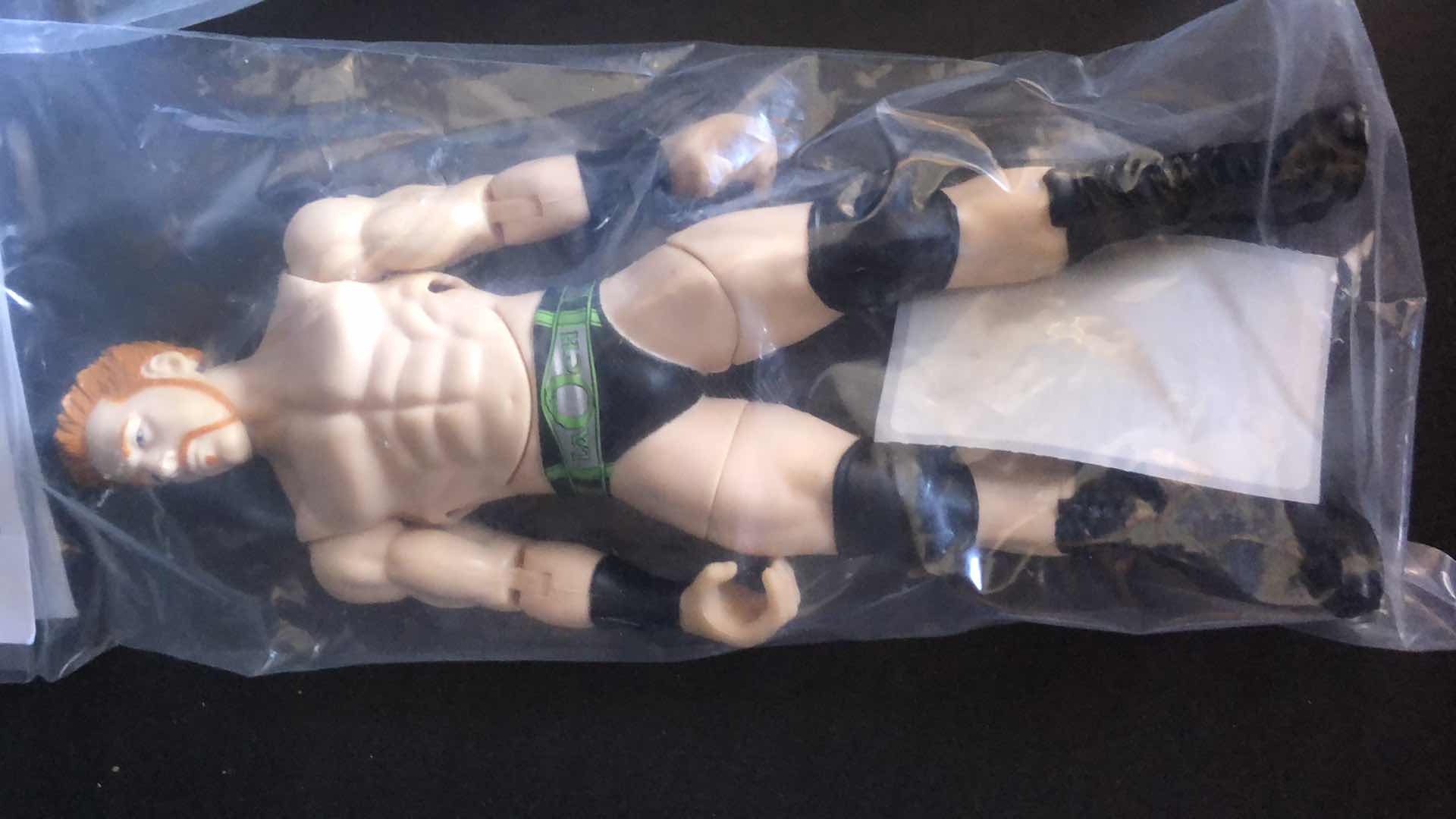 Photo 2 of ASSORTMENT OF UNBOXED WRESTLING ACTION FIGURES (4)