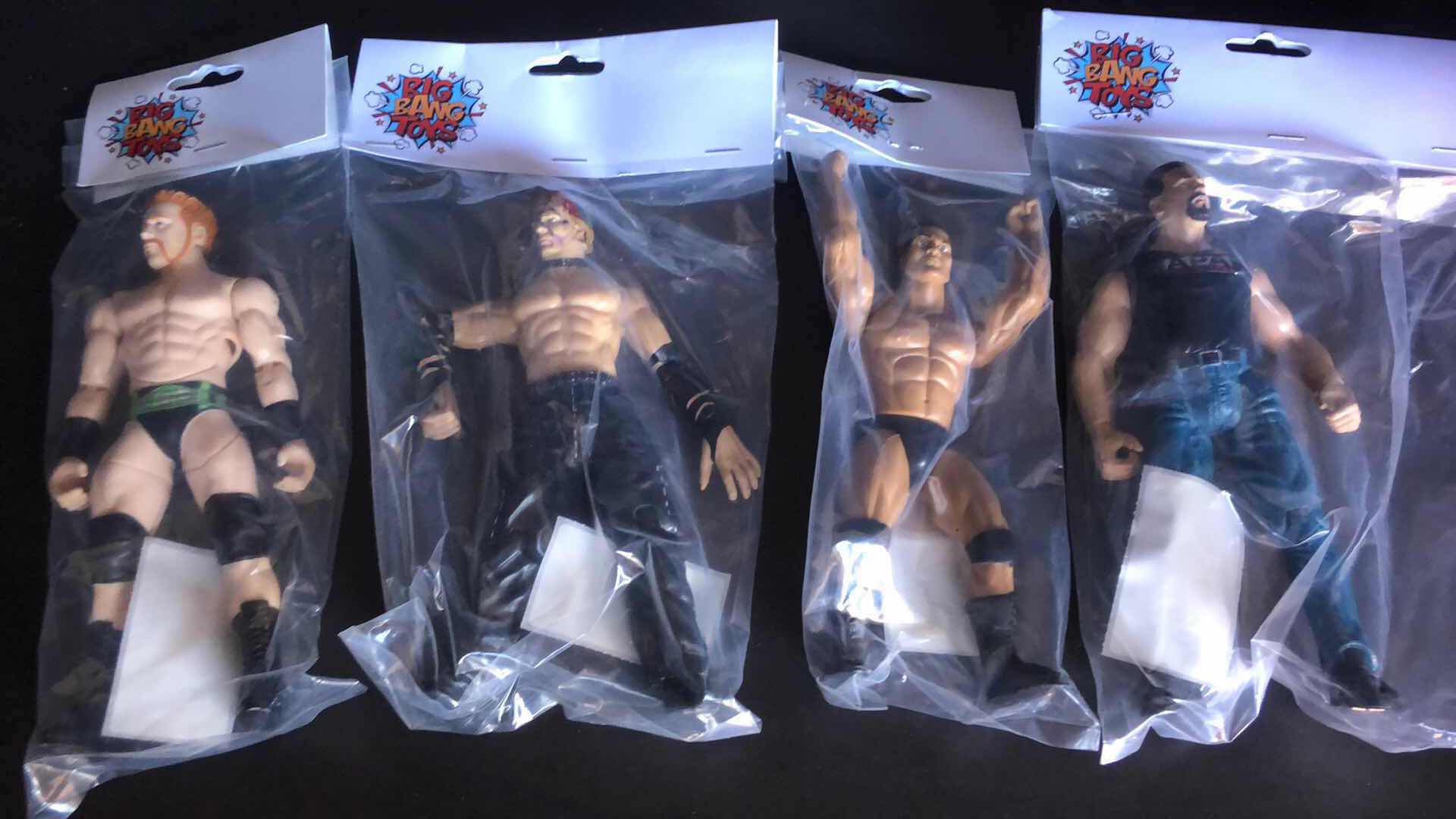 Photo 1 of ASSORTMENT OF UNBOXED WRESTLING ACTION FIGURES (4)