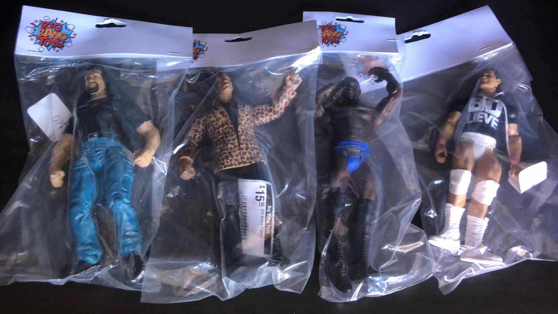 Photo 1 of ASSORTMENT OF UNBOXED WRESTLING ACTION FIGURES (4)