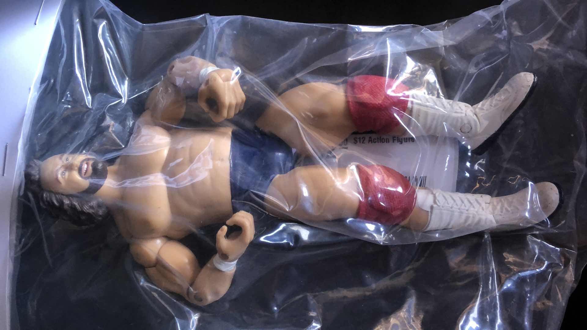 Photo 2 of ASSORTMENT OF UNBOXED WRESTLING ACTION FIGURES (4)