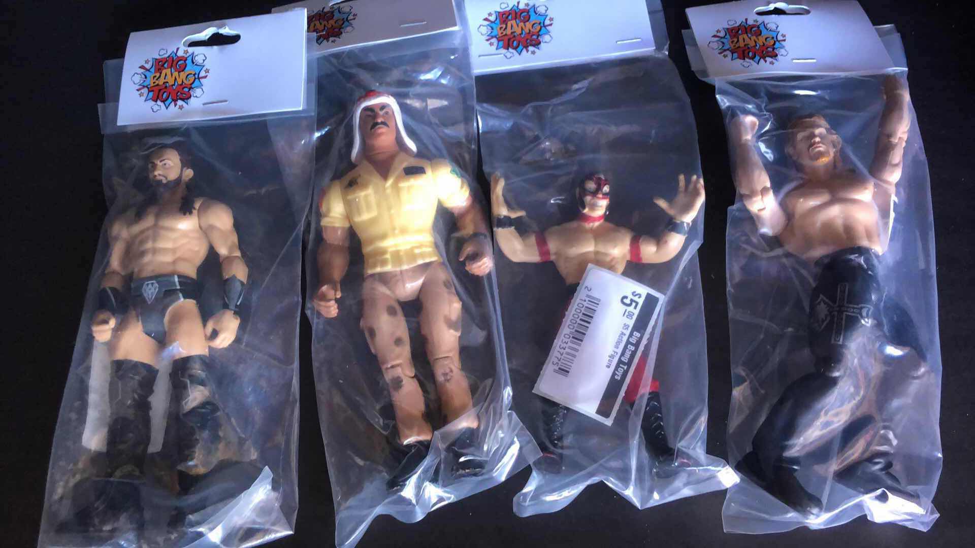 Photo 1 of ASSORTMENT OF UNBOXED WRESTLING ACTION FIGURES (4)