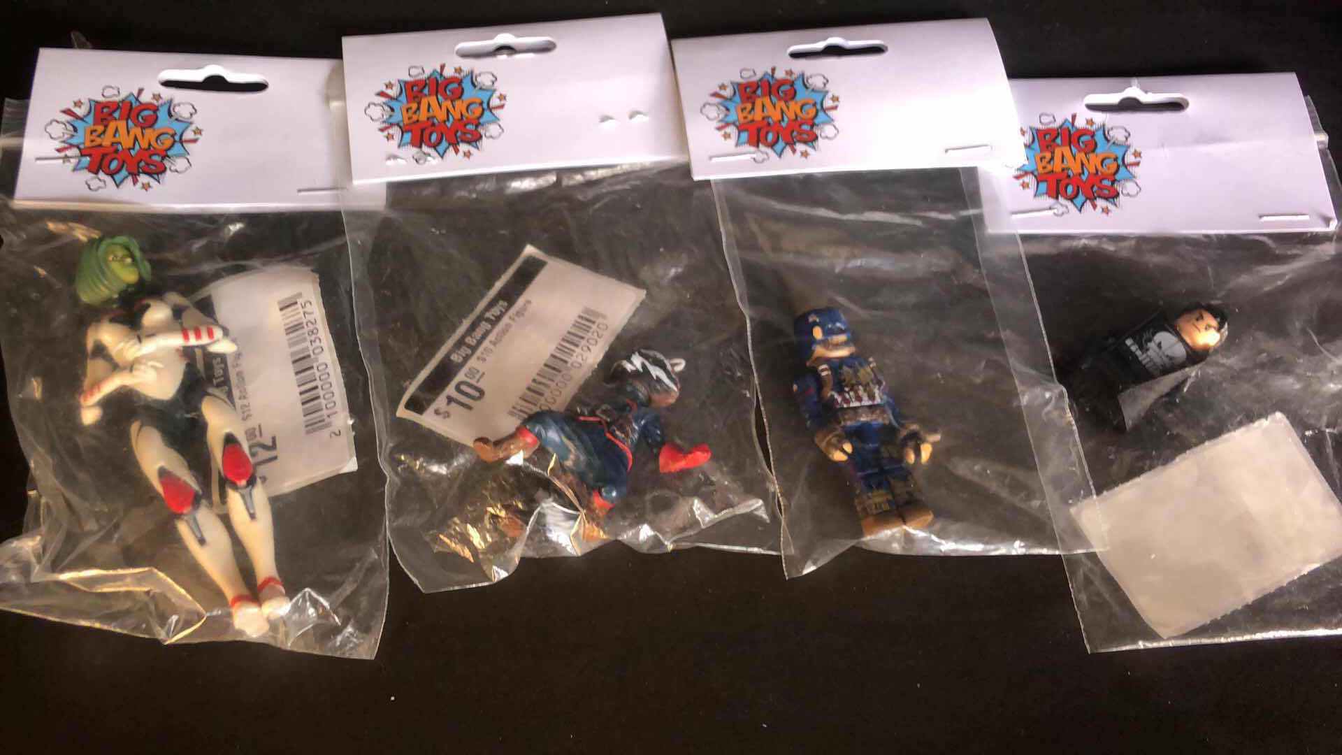 Photo 1 of ASSORTMENT OF UNBOXED SUPER HERO ACTION FIGURES (4)