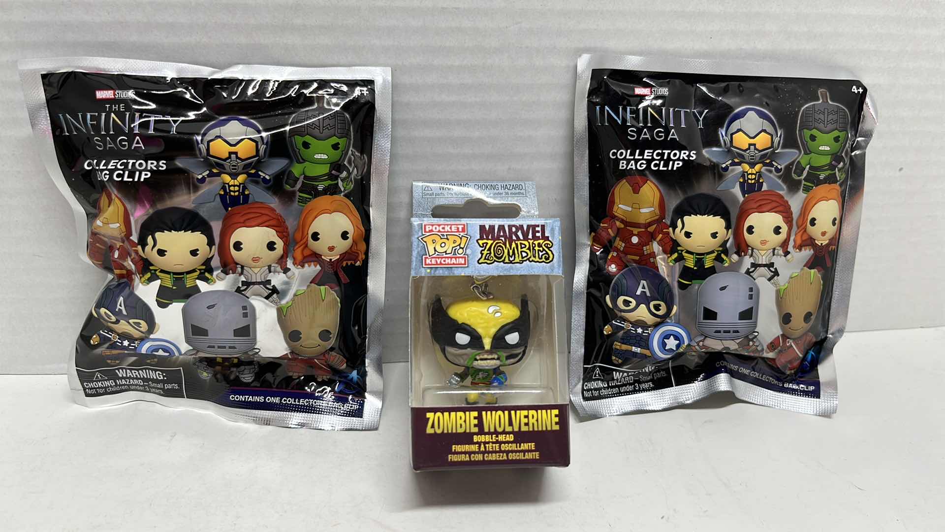 Photo 1 of NIP MARVEL STUDIOS THE INFINITY SAGA MYSTERY COLLECTORS BAG CLIP & MARVEL ZOMBIES WOLVERINE BOBBLEHEAD FUNKO POCKET POP KEY CHAIN (3)