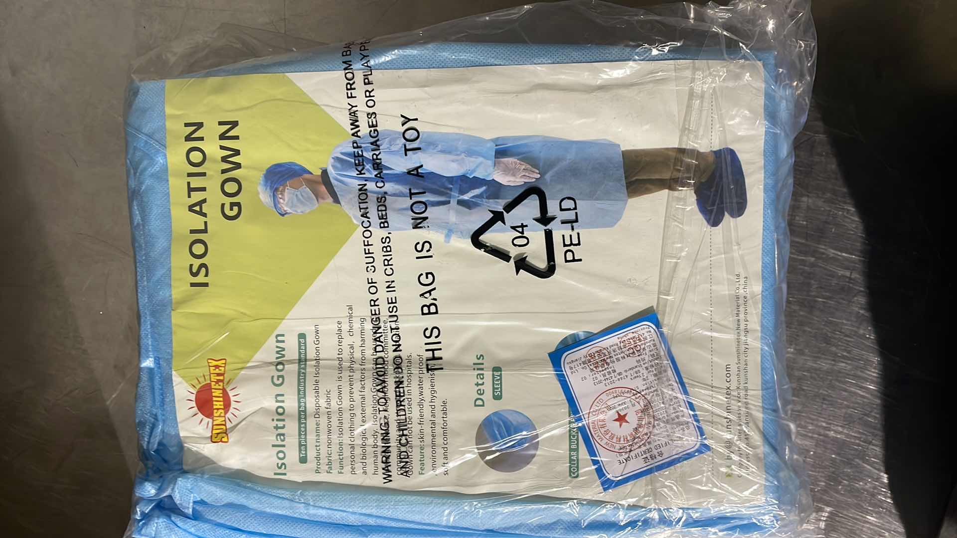 Photo 1 of DISPOSABLE ISOLATION GOWN CIVIL USE NON MEDICAL (100)