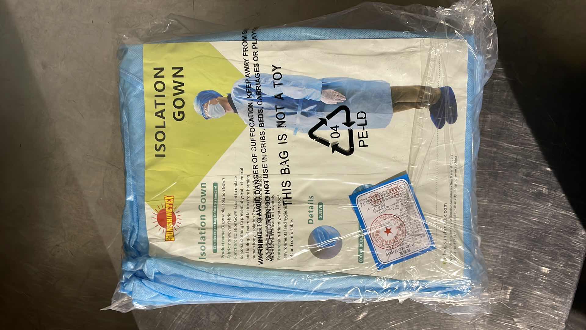 Photo 1 of DISPOSABLE ISOLATION GOWN CIVIL USE NON MEDICAL (100)