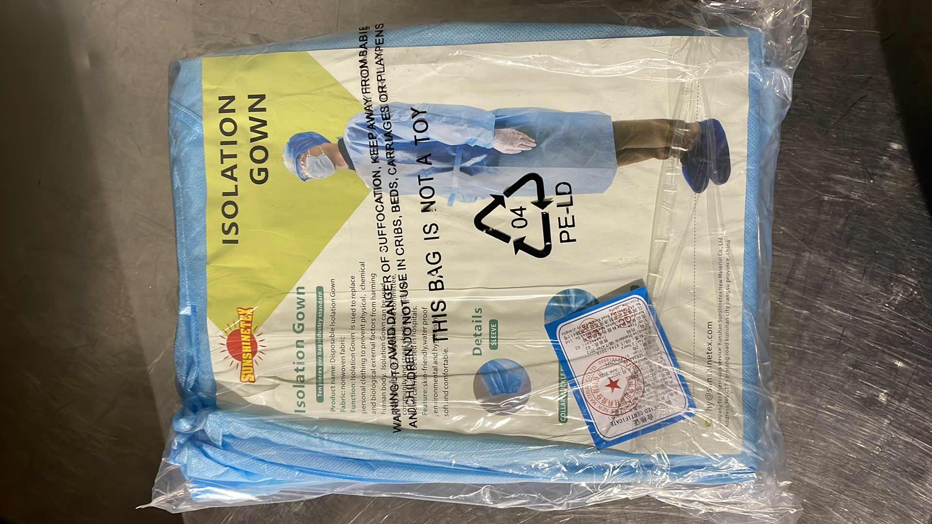 Photo 1 of DISPOSABLE ISOLATION GOWN CIVIL USE NON MEDICAL (100)