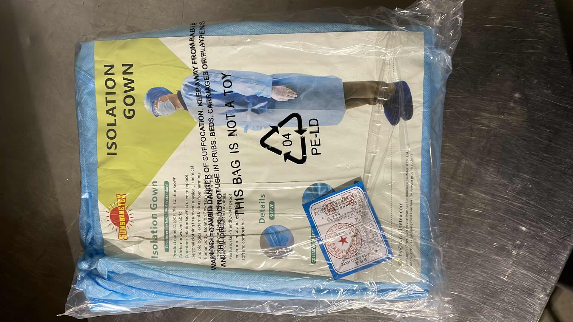 Photo 1 of DISPOSABLE ISOLATION GOWN CIVIL USE NON MEDICAL (100)