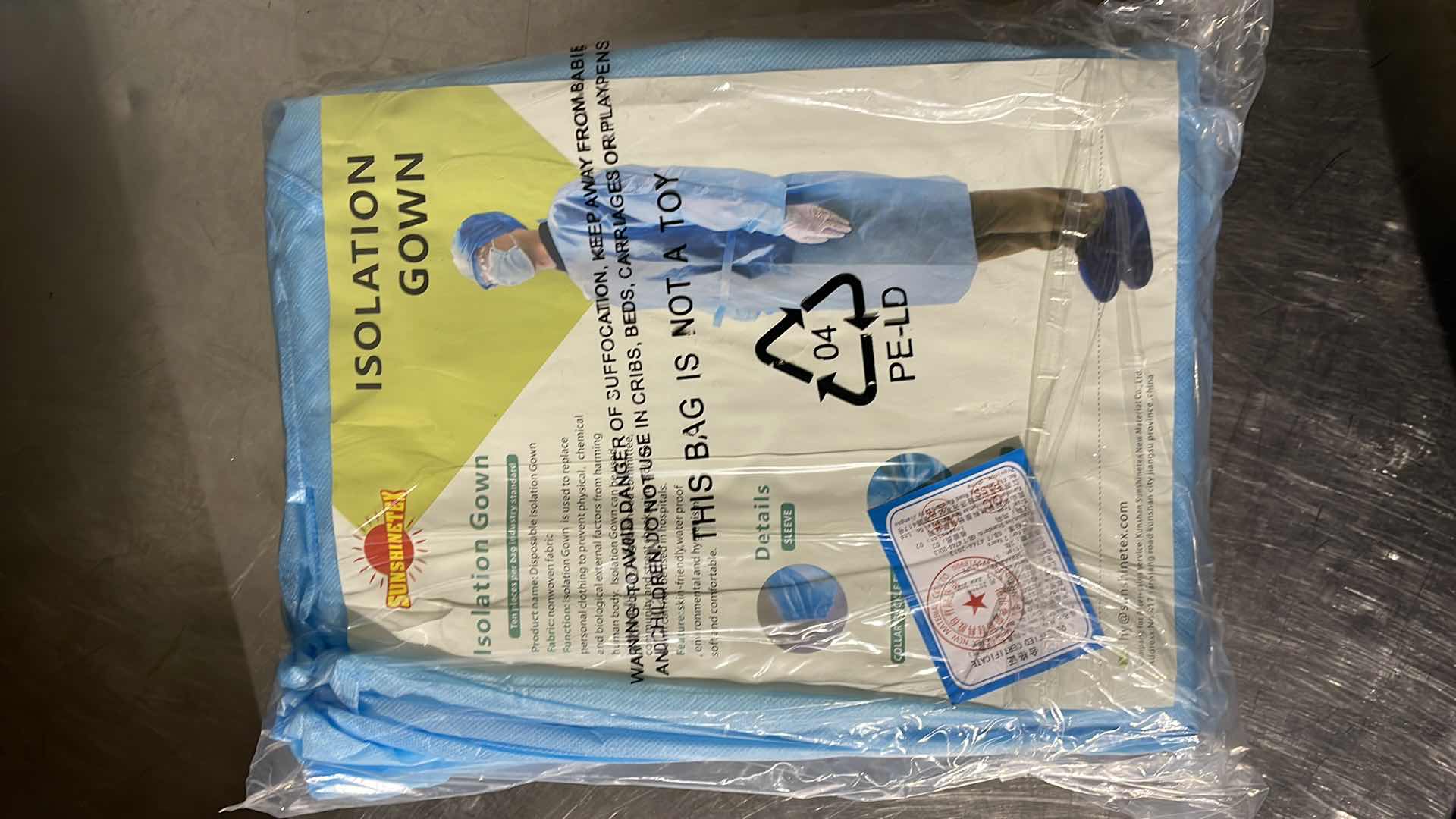 Photo 1 of DISPOSABLE ISOLATION GOWN CIVIL USE NON MEDICAL (100)