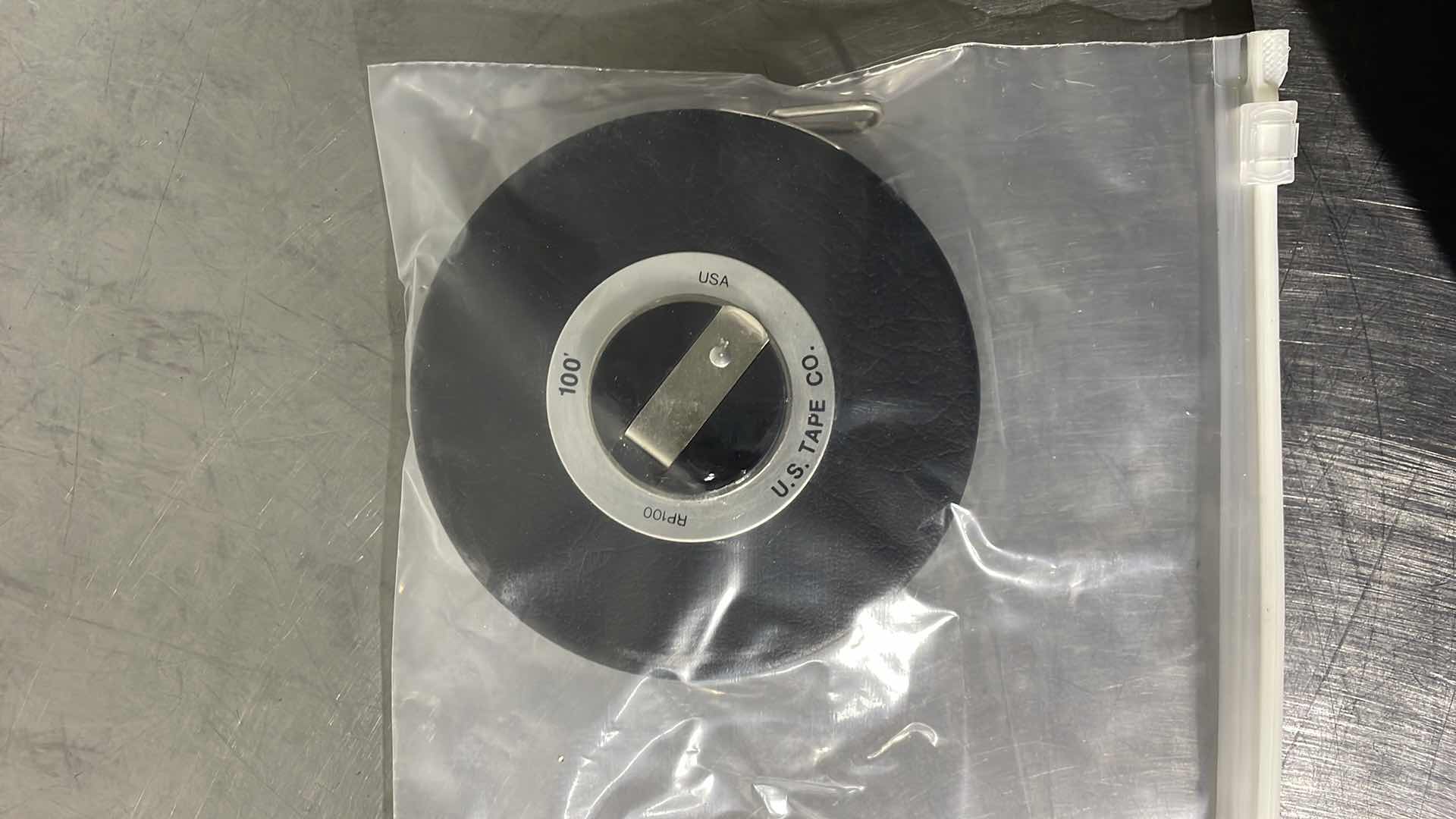 Photo 1 of USGI VINTAGE U.S. TAPE CO. RP100, 100' STEEL MANUAL ENGINEERING MEASURING TAPE