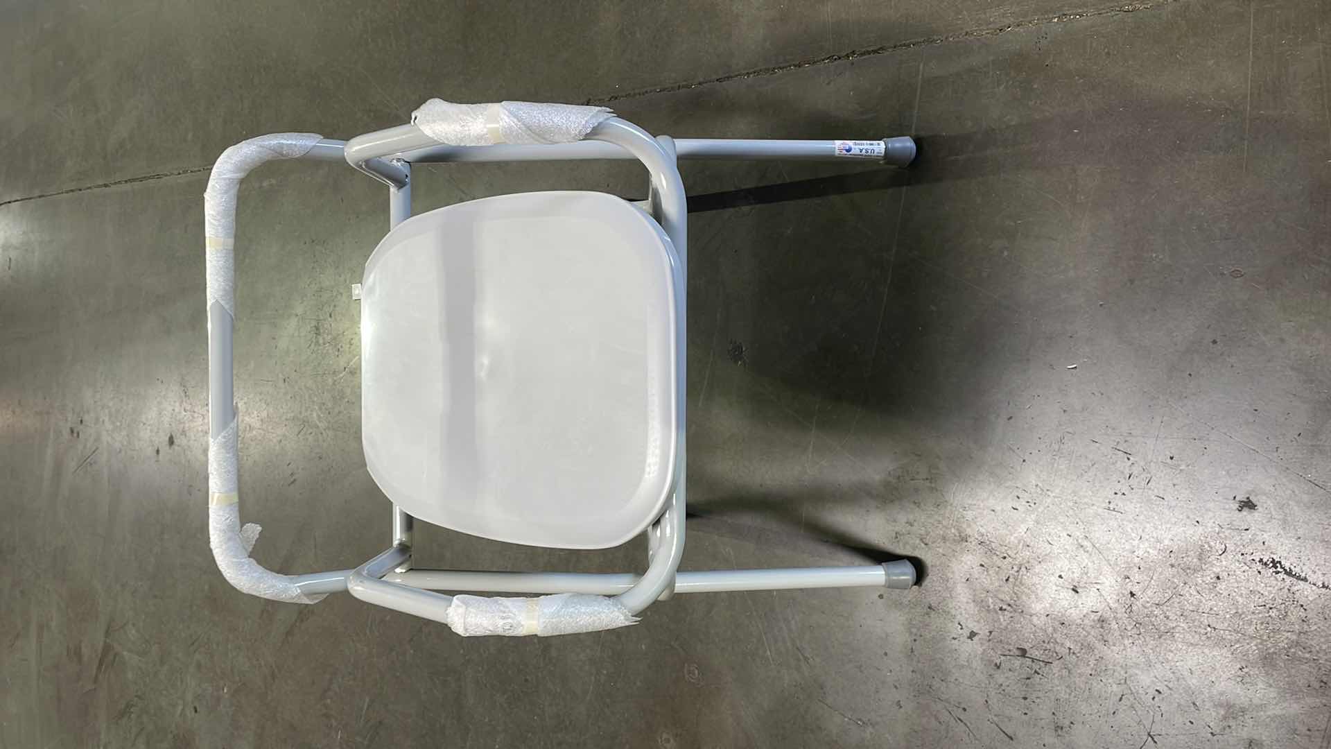 Photo 2 of PATTERSON MEDICAL 556402 SPACESAVER FOLDABLE COMMODE WITH ELONGATED SEAT