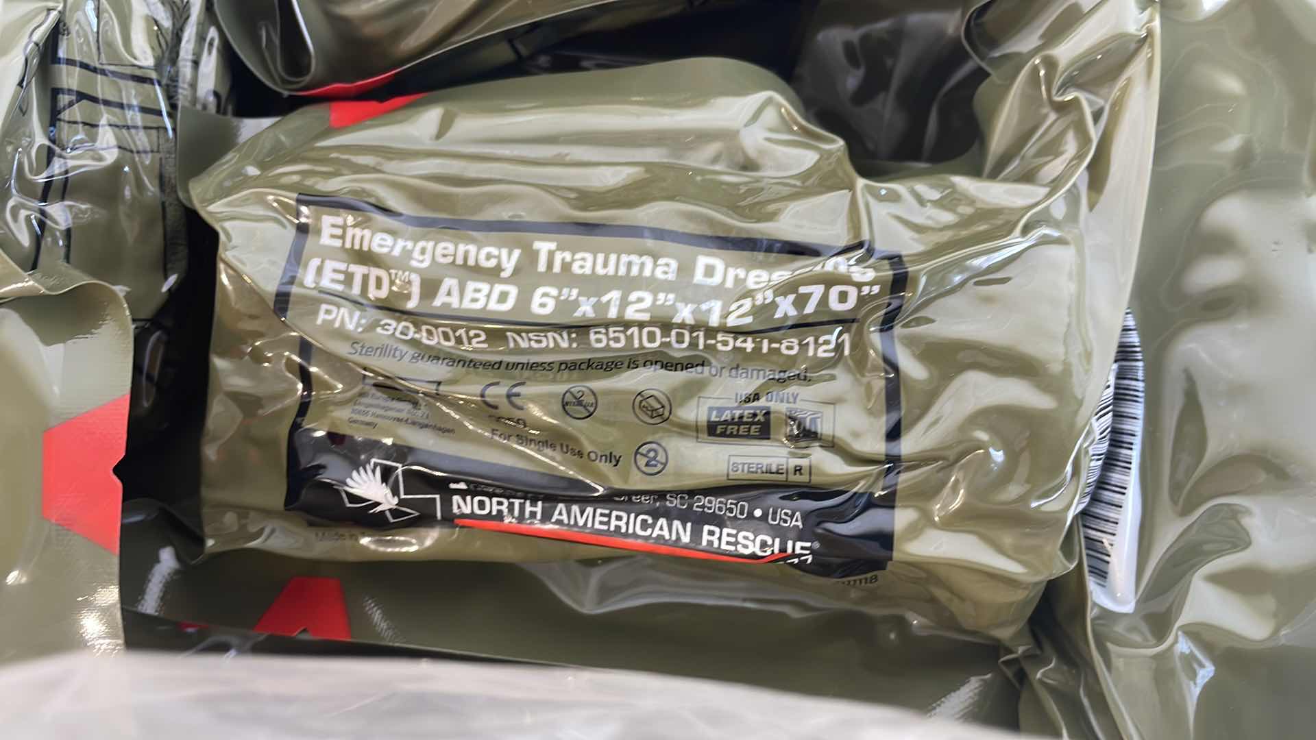 Photo 2 of EMERGENCY TRAUMA DRESSING 6” X 12” X 70” (25) EXP 6/23