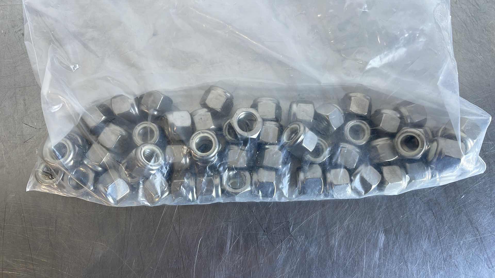 Photo 2 of 1/2” - 13 COURSE STAINLESS STEEL NYLON LOCKNUTS (125)