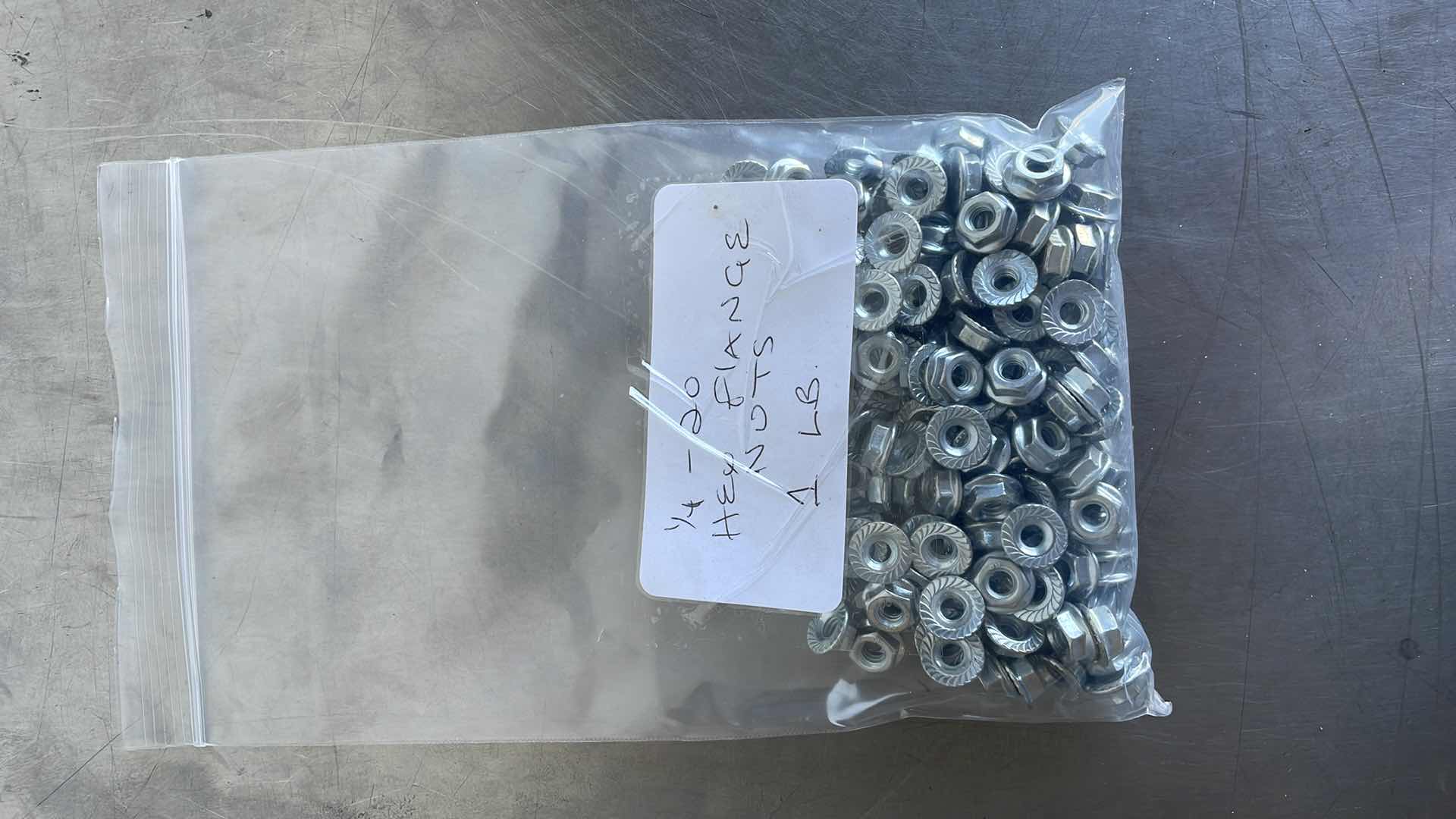 Photo 1 of 1/4-20 HEX FLANGE NUTS 1 LB.