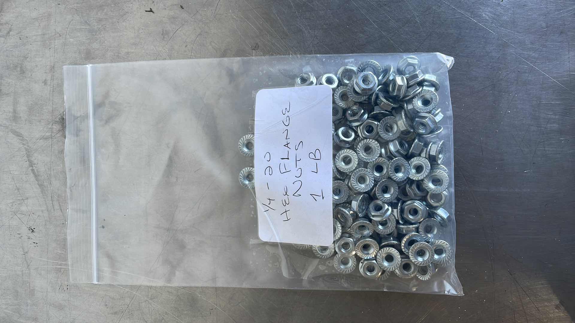Photo 1 of 1/4-20 HEX FLANGE NUTS 1 LB