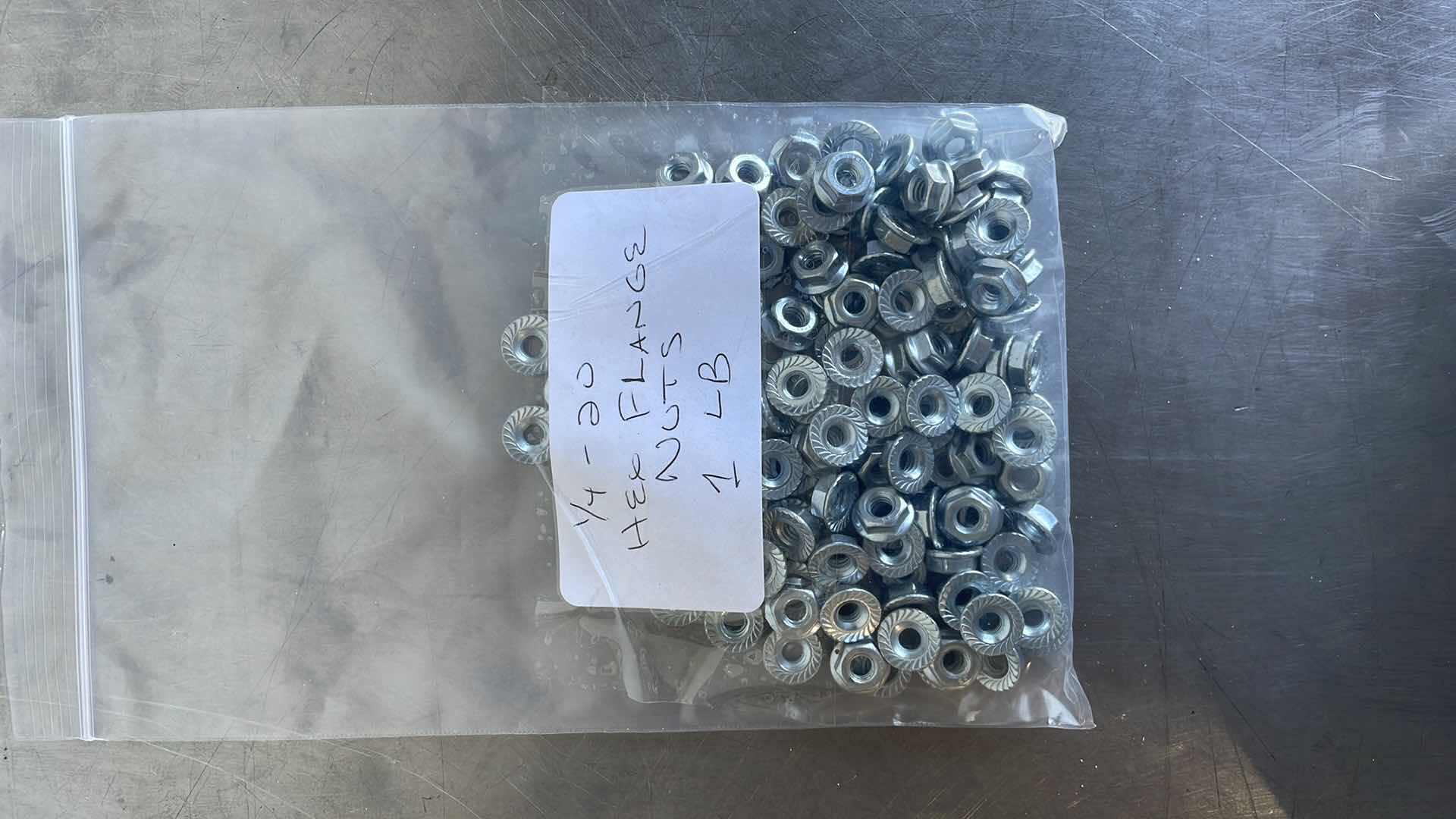 Photo 1 of 1/4-20 HEX FLANGE NUTS 1 LB