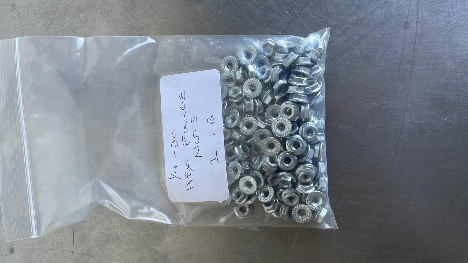 Photo 1 of 1/4-20 HEX FLANGE NUTS 1 LB