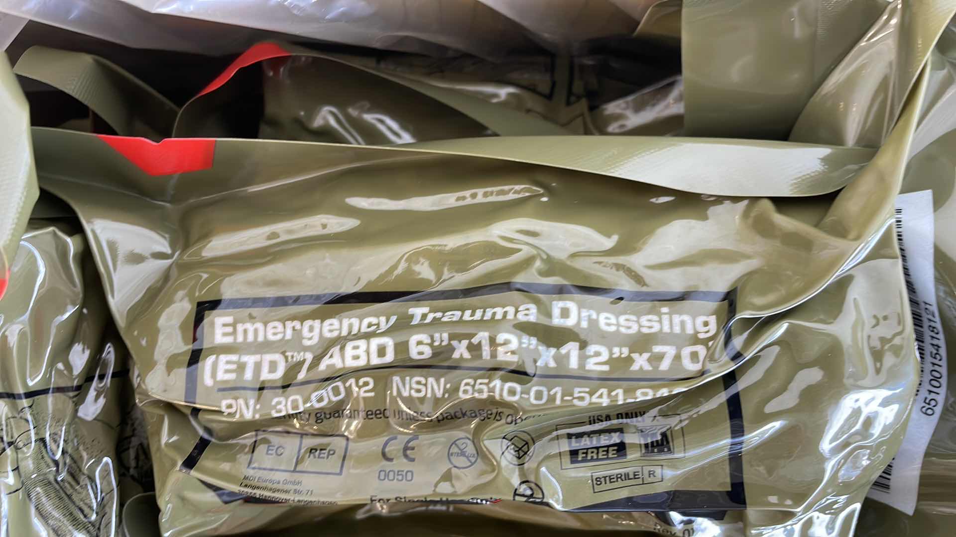 Photo 1 of EMERGENCY TRAUMA DRESSING 6” X 12” X 70” (25) EXP 6/23