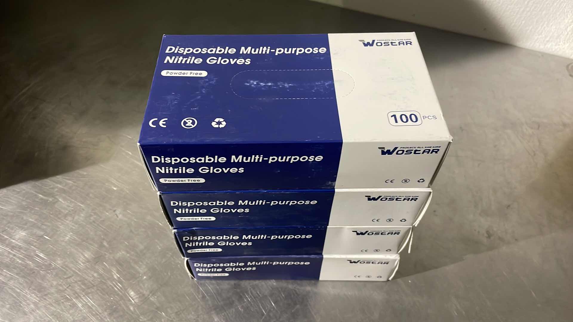 Photo 1 of WOSTAR NITRILE DISPOSABLE GLOVES 4 MIL POWDER LATEX FREE DISPOSABLE NON-STERILE NITRILE EXAM GLOVES 3 BOXES SMALL 1 BOX MEDIUM