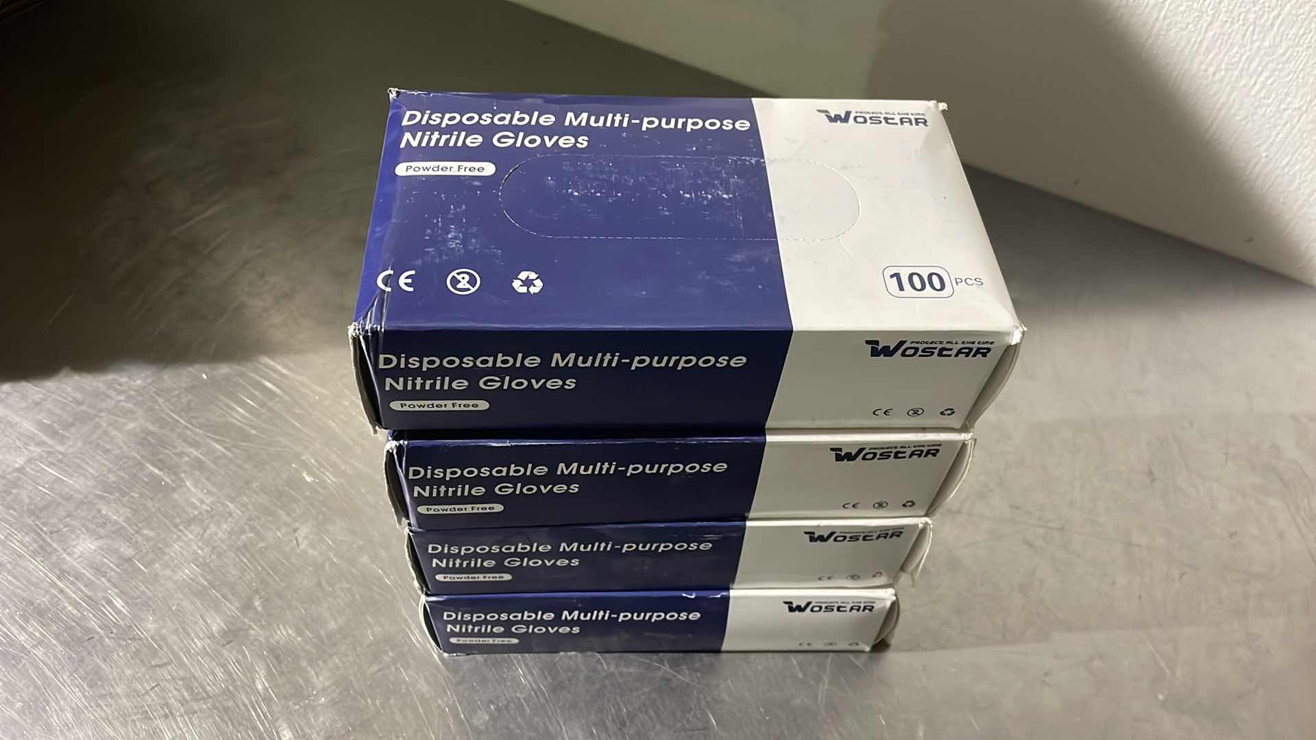 Photo 1 of WOSTAR NITRILE DISPOSABLE GLOVES 4 MIL POWDER LATEX FREE DISPOSABLE NON-STERILE NITRILE EXAM GLOVES EXTRA LARGE (4 BOXES)