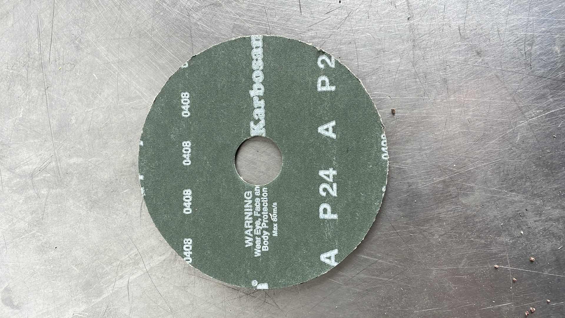 Photo 2 of ALUMINUM OXIDE RESIN FIBER 4-INCH RESIN FIBER SANDING DISCS CENTER HOLE 24 GRIT SANDING DISC FOR ANGLE GRINDER (22)