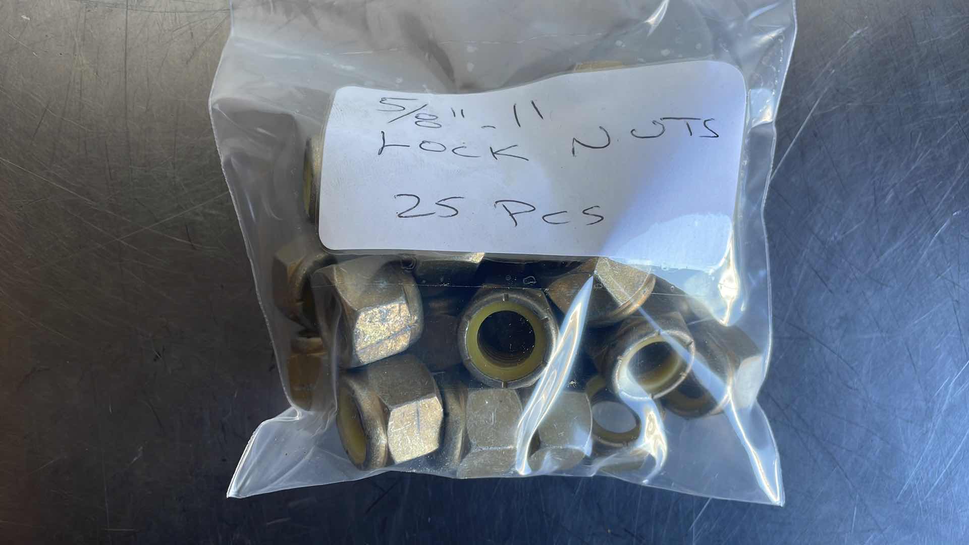 Photo 1 of 5/8”-11 LOCKNUTS 25PCS