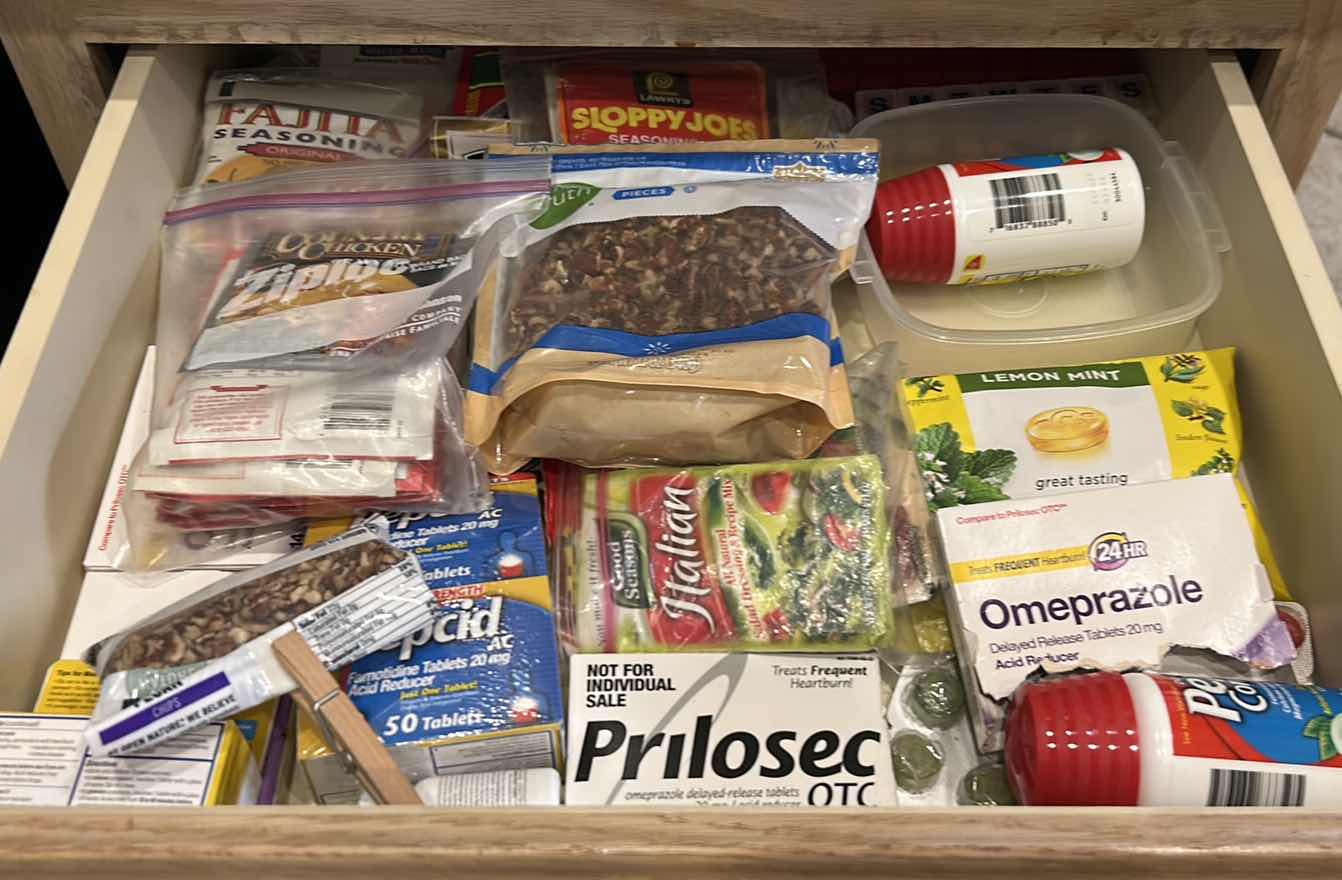 Photo 1 of CONTENTS OF PULL OUT DRAWER IN KITCHEN- SEASONING MIXES AND MORE