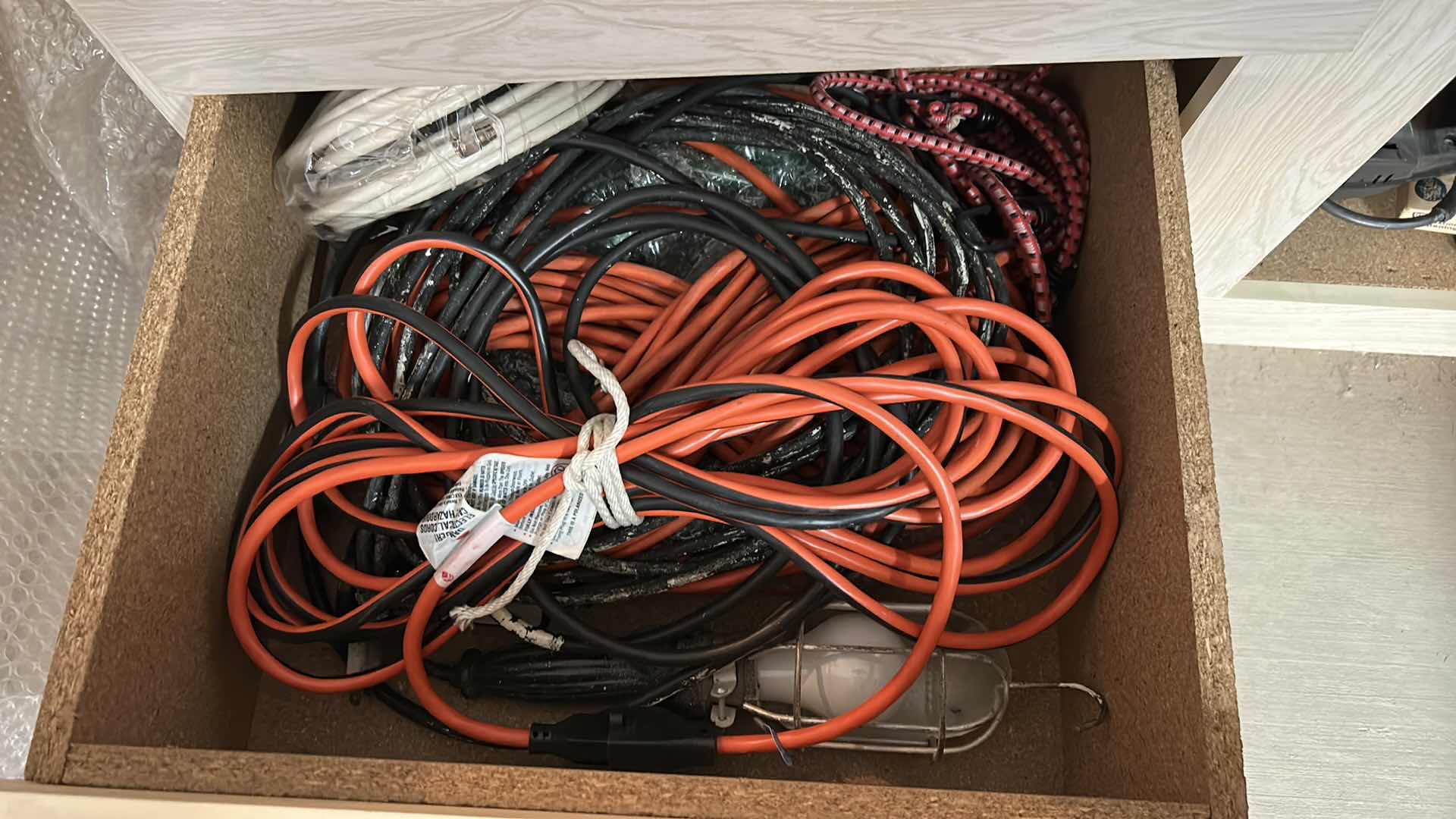 Photo 1 of CONTENTS PULL OUT DRAWER IN GARAGE - CORDS