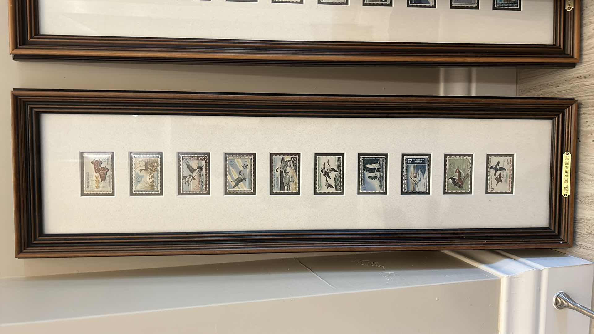 Photo 2 of 40 DUCK STAMPS, 1960’s - 1990’s and HARDCOVER DUCK STAMP COFFEE TABLE BOOK, FRAMED BY DECADE ARTWORK 9“ x 29 1/2“