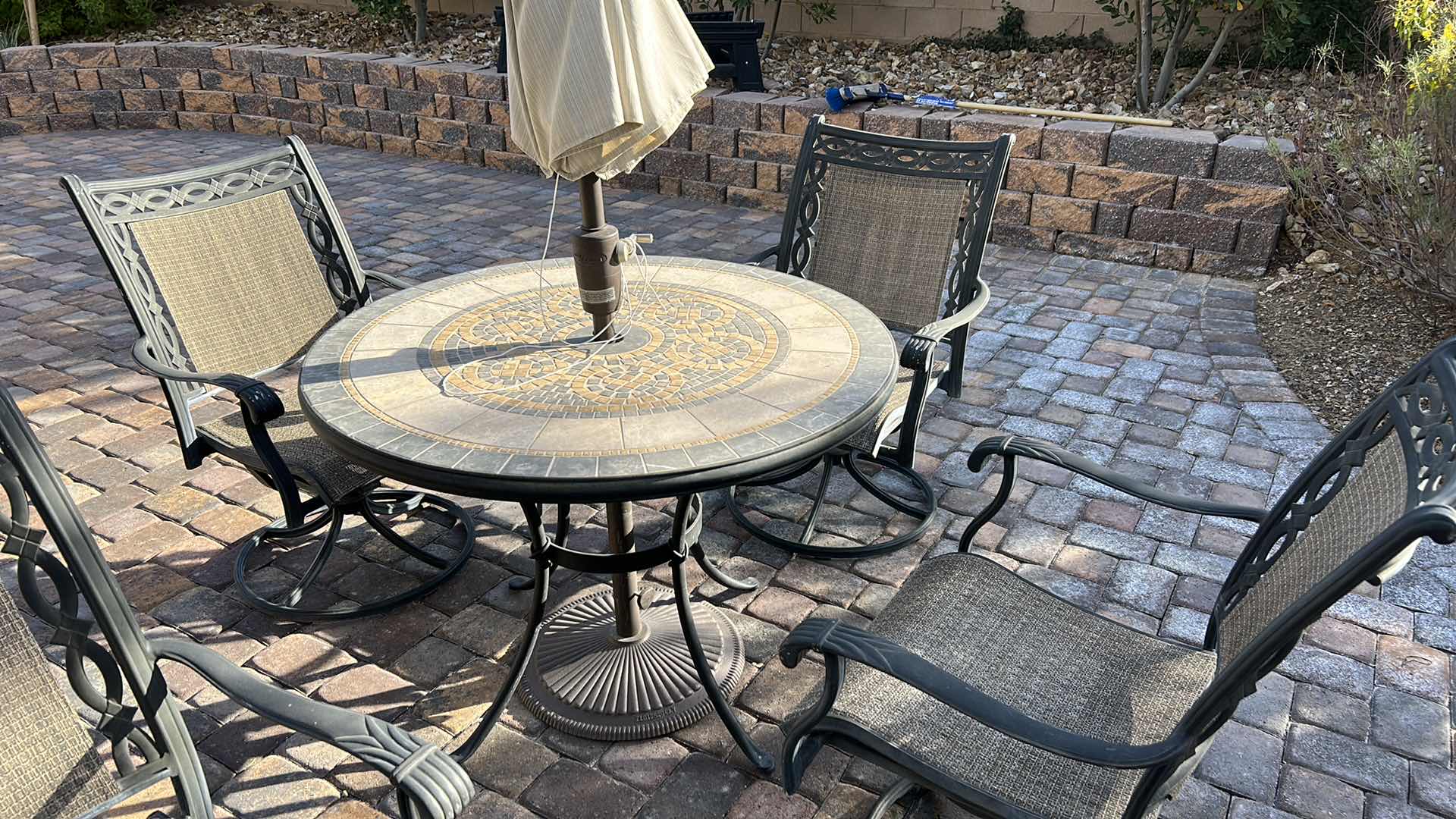 Photo 5 of OUTDOOR 42” ROUND PATIO TABLE WITH 4 SWIVEL ROCKING CHAIRS (UMBRELLA IS BROKEN)