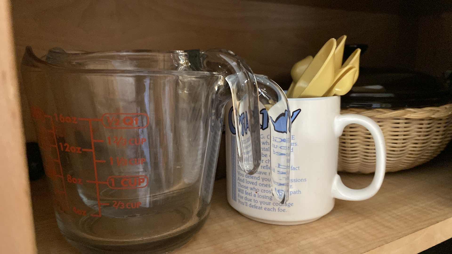 Photo 2 of CONTENTS OF KITCHEN CABINET MIXING BOWLS MEASURING CUPS BASKETS