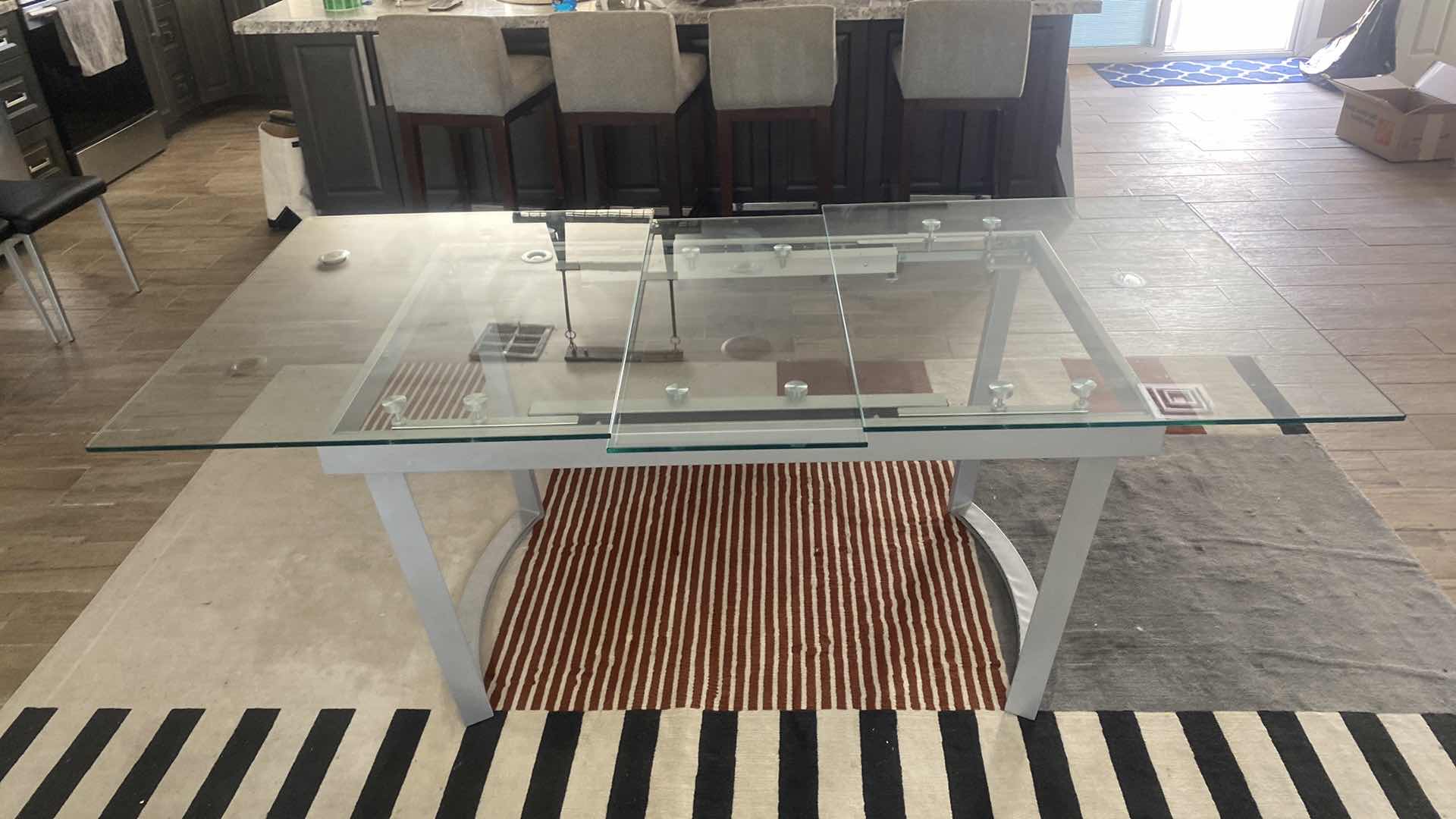 Photo 3 of GLASS AND SILVER METAL EXPANDABLE DINING TABLE - 63”x38” H30” (EXTENSION 15 1/2”