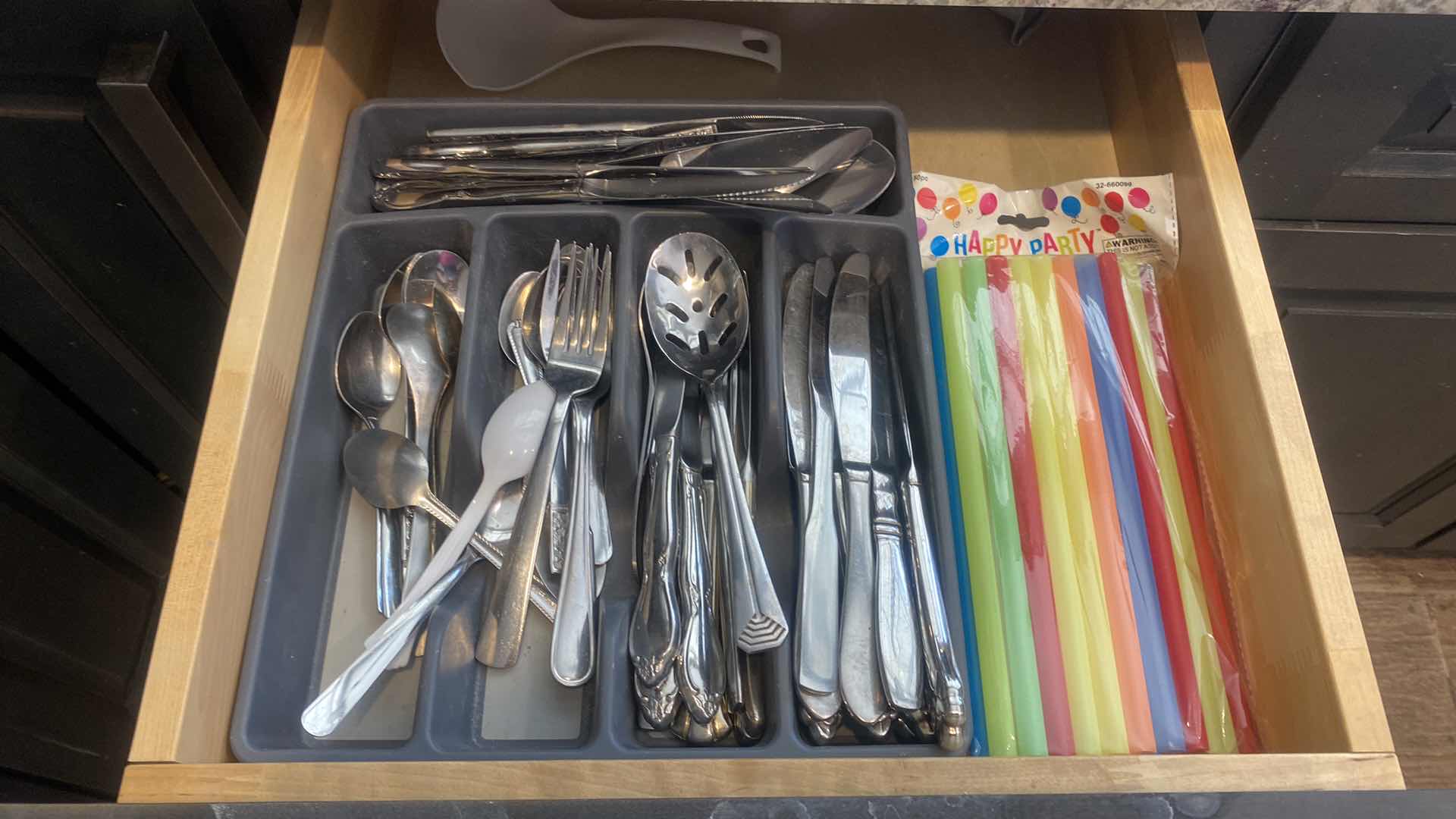 Photo 1 of CONTENTS KITCHEN CABINET-DRAWER WITH SILVERWARE & STRAWS