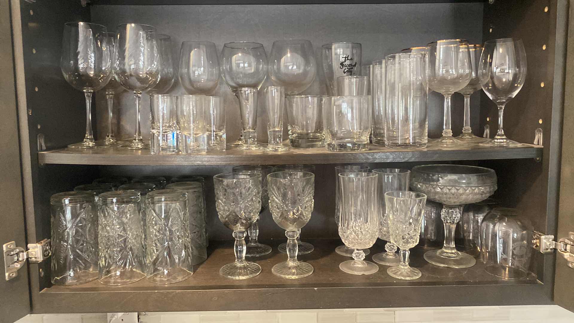 Photo 1 of CONTENTS KITCHEN CABINET-2 SHELVES GLASSES & BARWARE