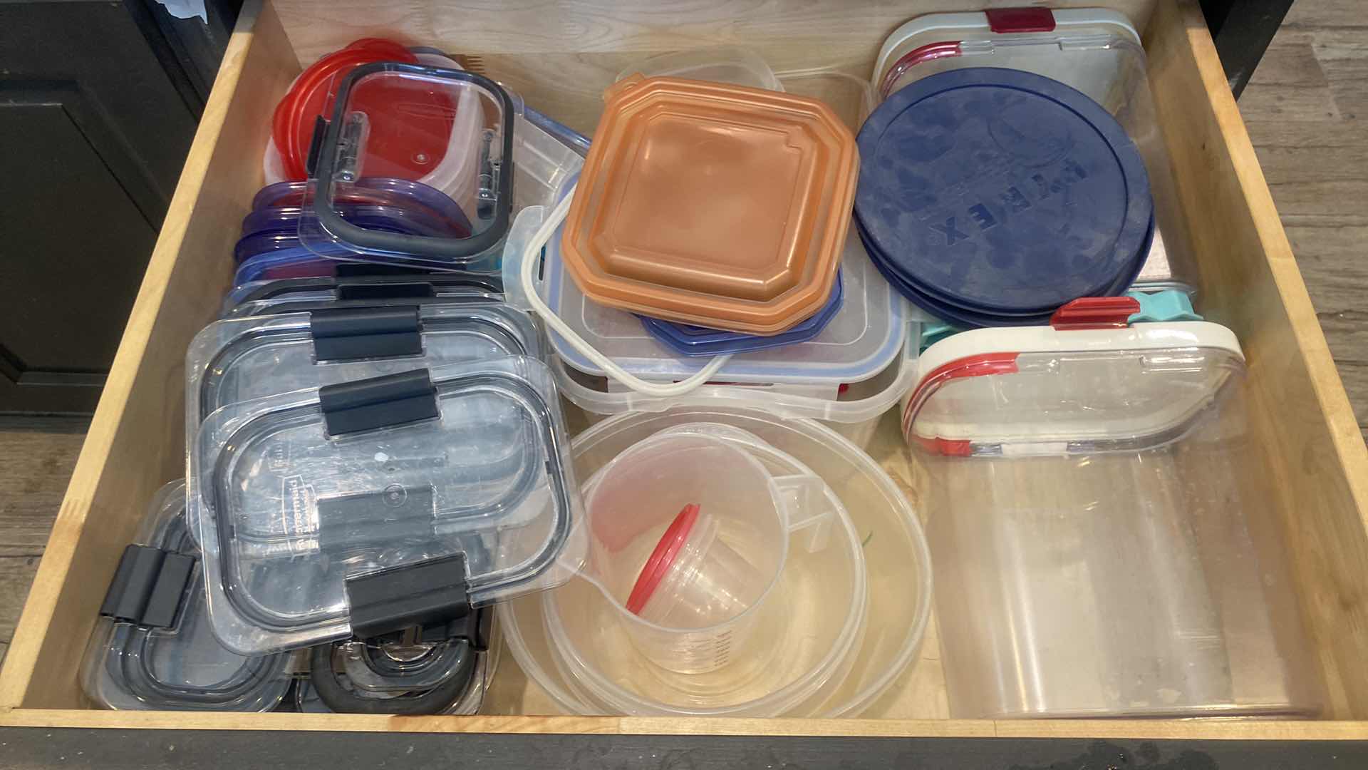 Photo 1 of CONTENTS KITCHEN CABINET-DRAWER WITH PLASTIC STORAGE AND LIDS