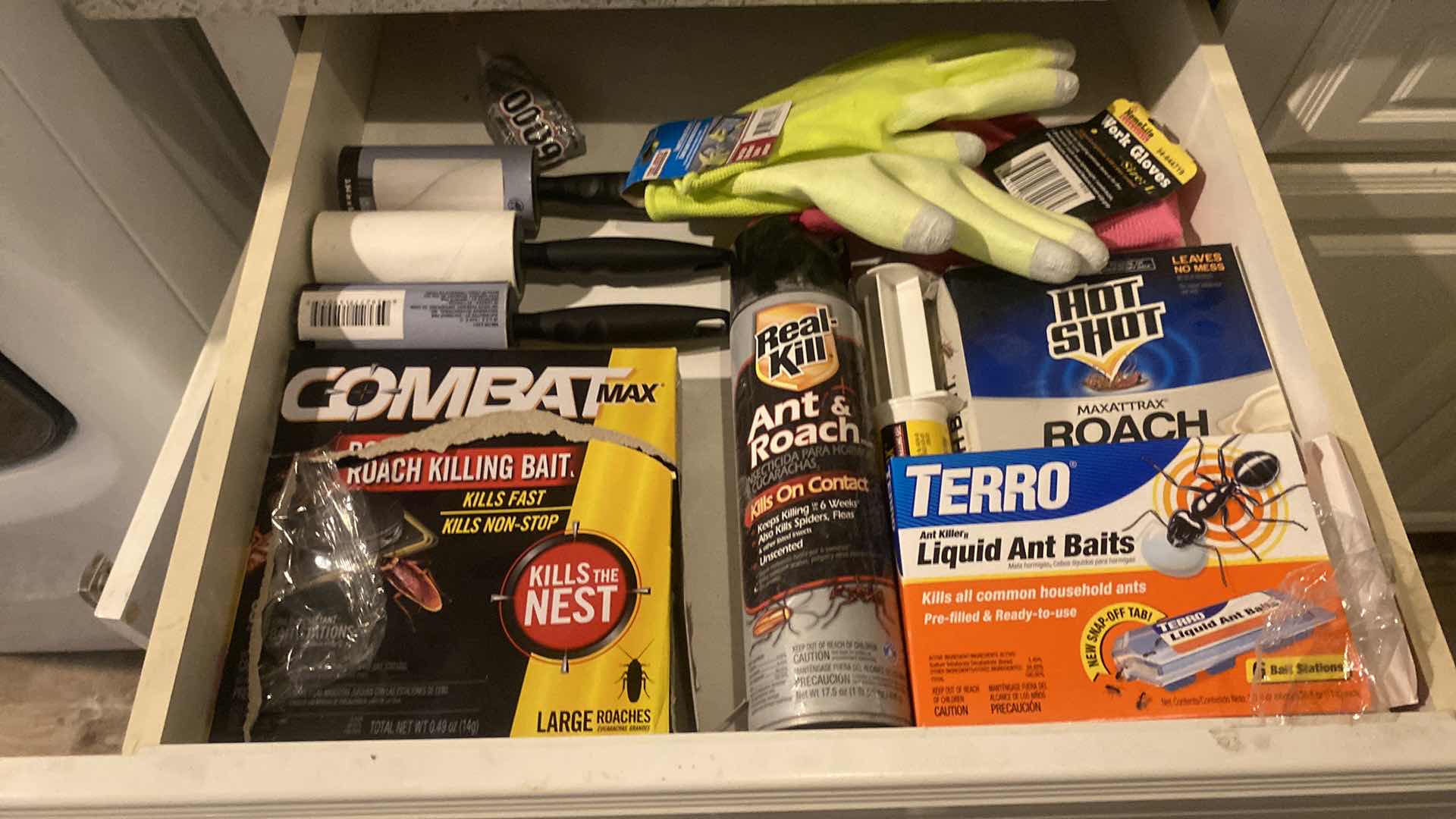 Photo 1 of CONTENTS LAUNDRY ROOM DRAWER- BUG BAIT SPRAY & GLOVES & LINT ROLLERS