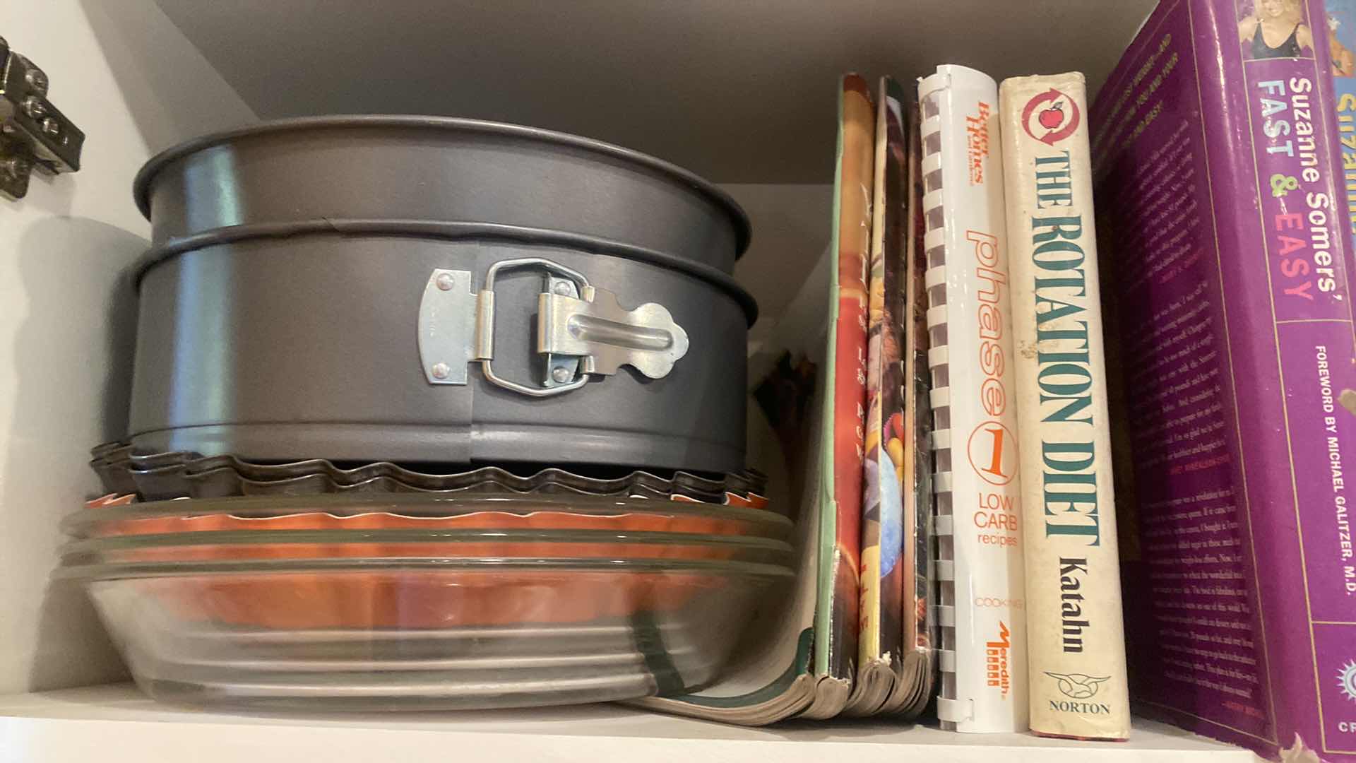 Photo 1 of CONTENTS OF KITCHEN CABINET -  COOK BOOKS & BAKEWARE