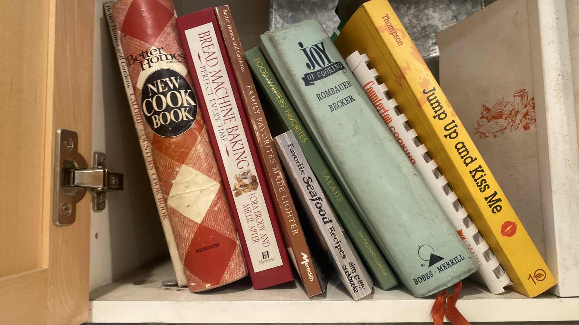 Photo 1 of CONTENTS OF KITCHEN CABINET - COOKBOOKS