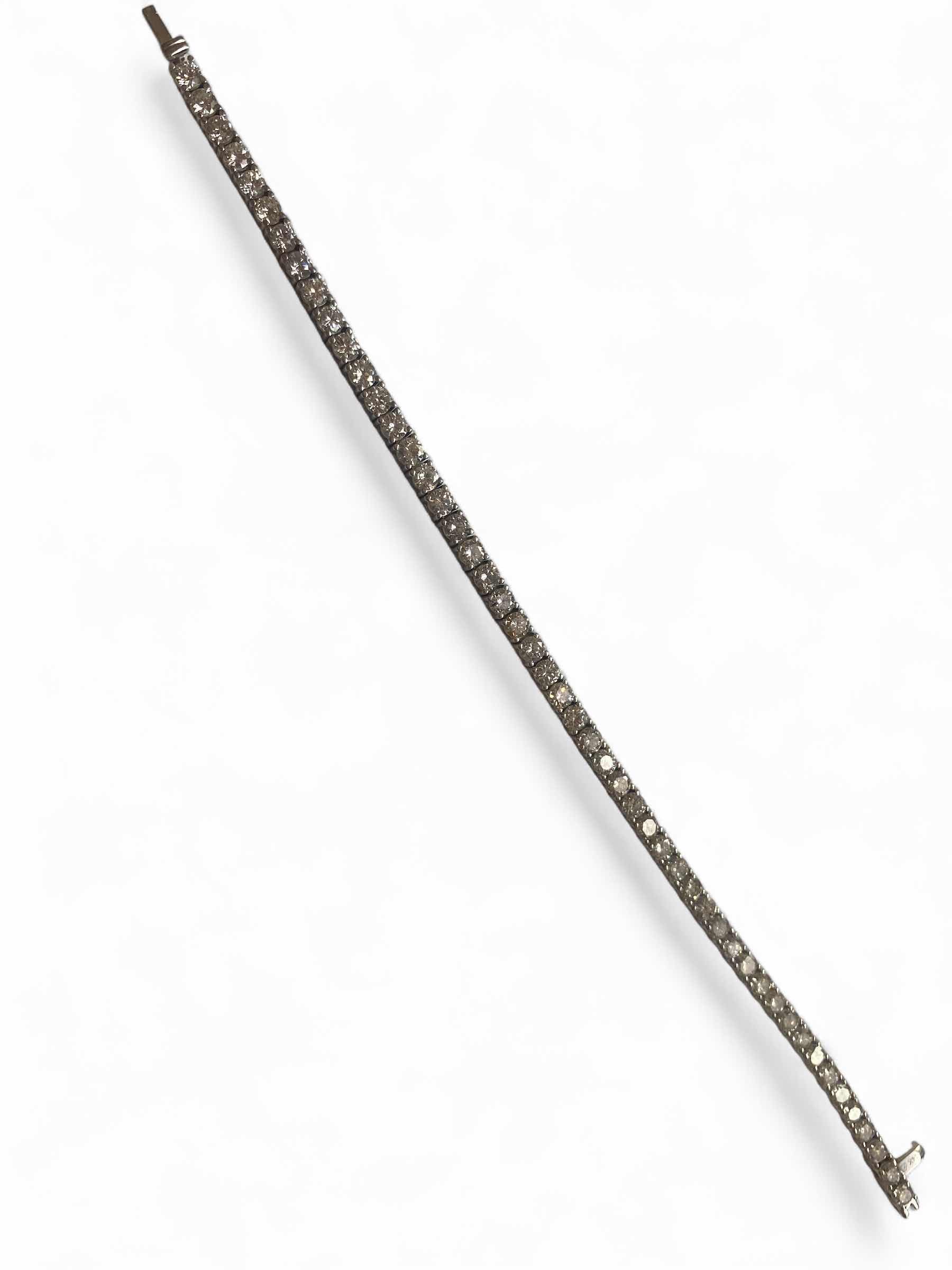 Photo 1 of 14K WHITE GOLD. W 7.5cwt DIAMOND TENNIS BRACELET 12.5 TTL G  #5 EST VALUE $40,250