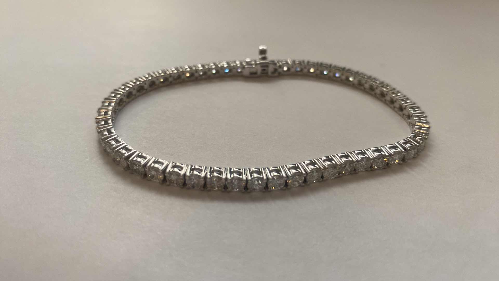 Photo 1 of 14K WHITE GOLD. W 7.5cwt DIAMOND TENNIS BRACELET 12.5 TTL G  #5 EST VALUE $40,250