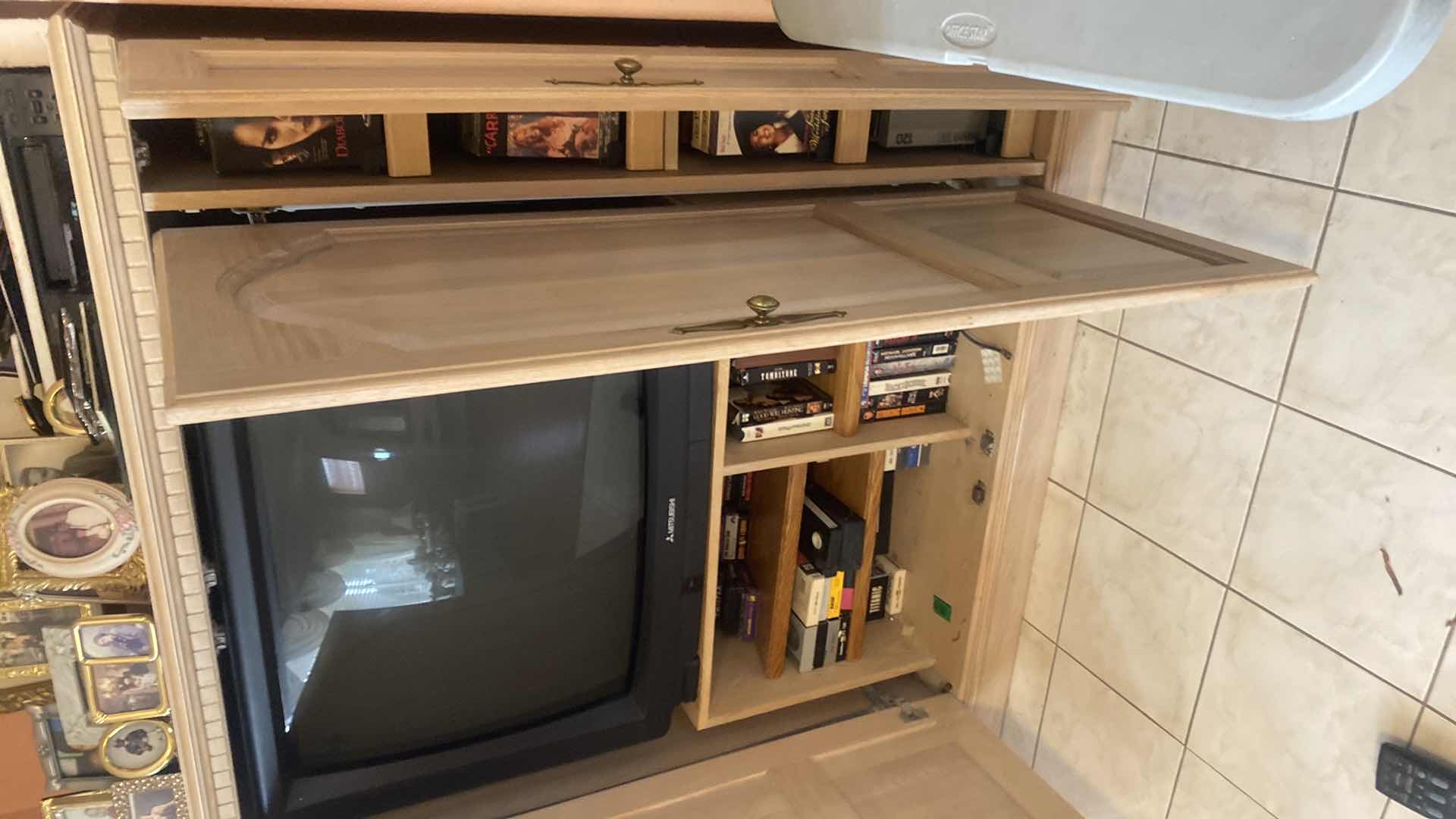 Photo 1 of LIGHT WOOD ENTERTAINMENT CENTER 58” x 24 1/2” H 58”