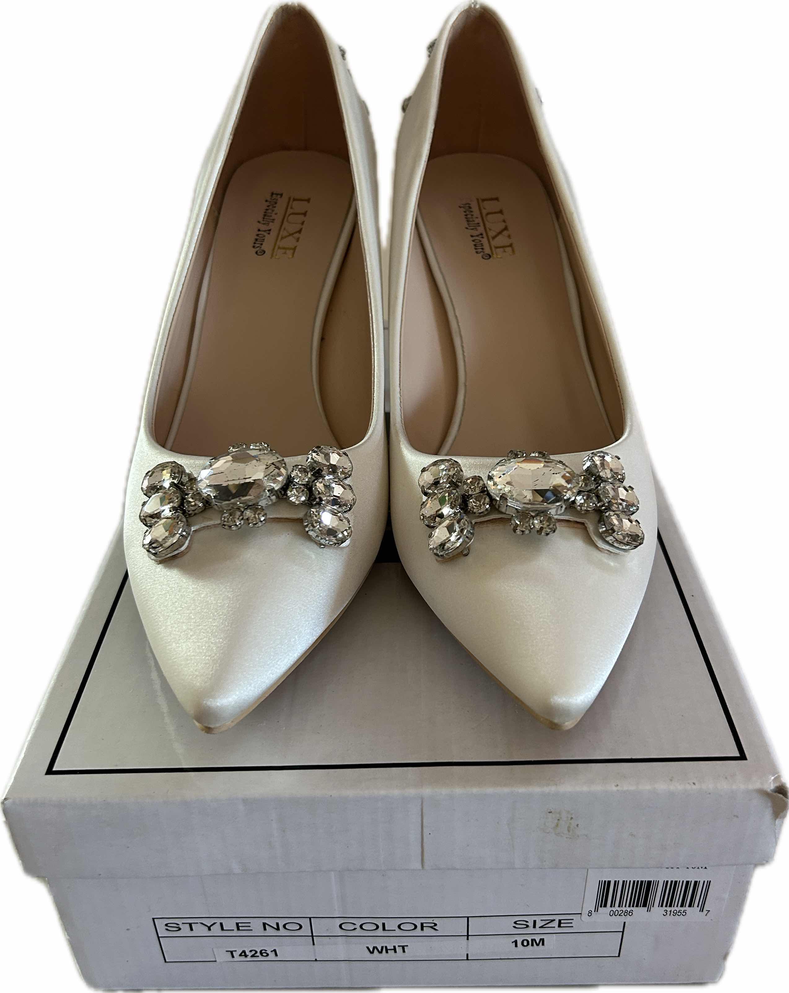 Photo 1 of NEW WOMENS WHT HEELS SIZE 10