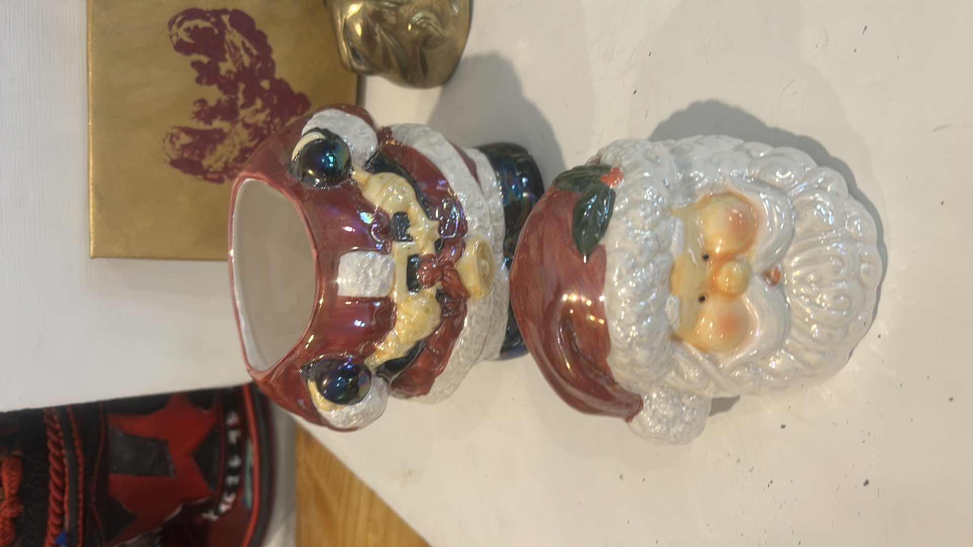 Photo 1 of CHRISTMAS DECOR /  LIDDED SANTA JAR, NAPKIN RINGS, BRASS REINDEER, ARTWORK & GLASS TRINKET DISH