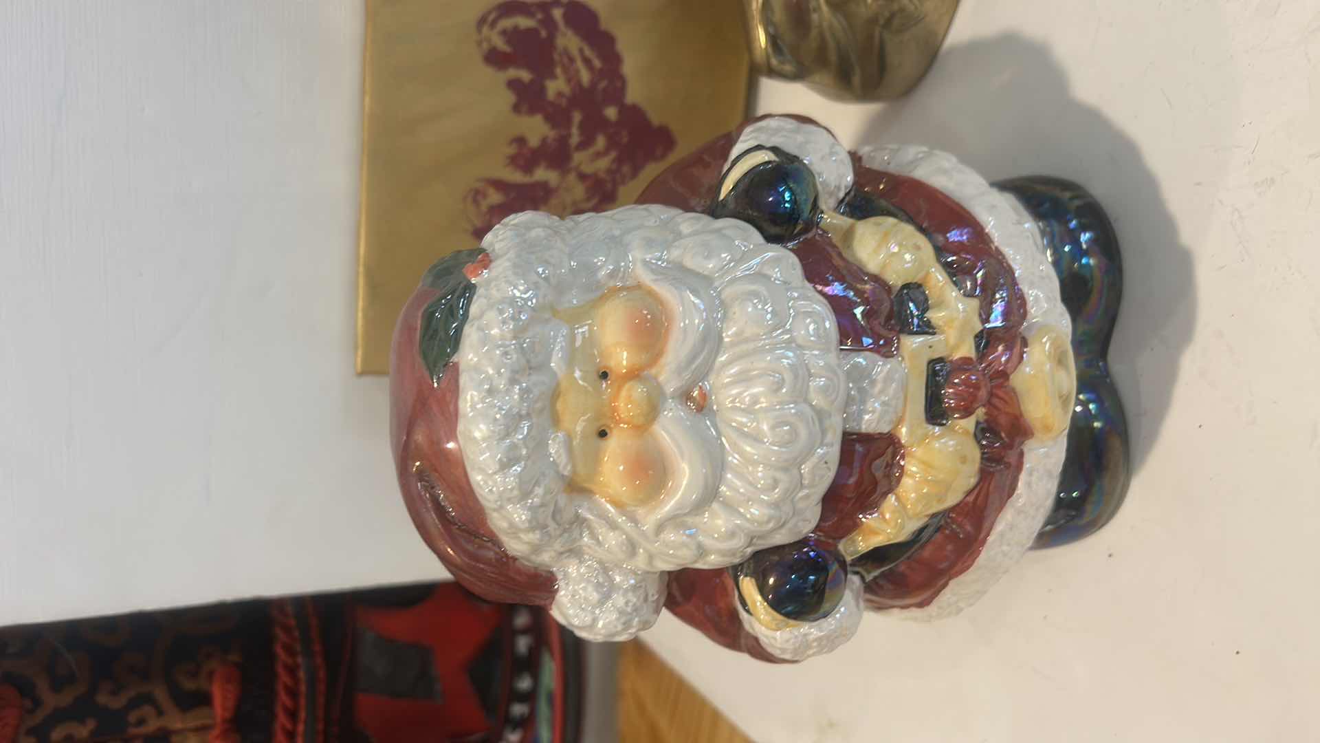 Photo 1 of CHRISTMAS DECOR /  LIDDED SANTA JAR, NAPKIN RINGS, BRASS REINDEER, ARTWORK & GLASS TRINKET DISH