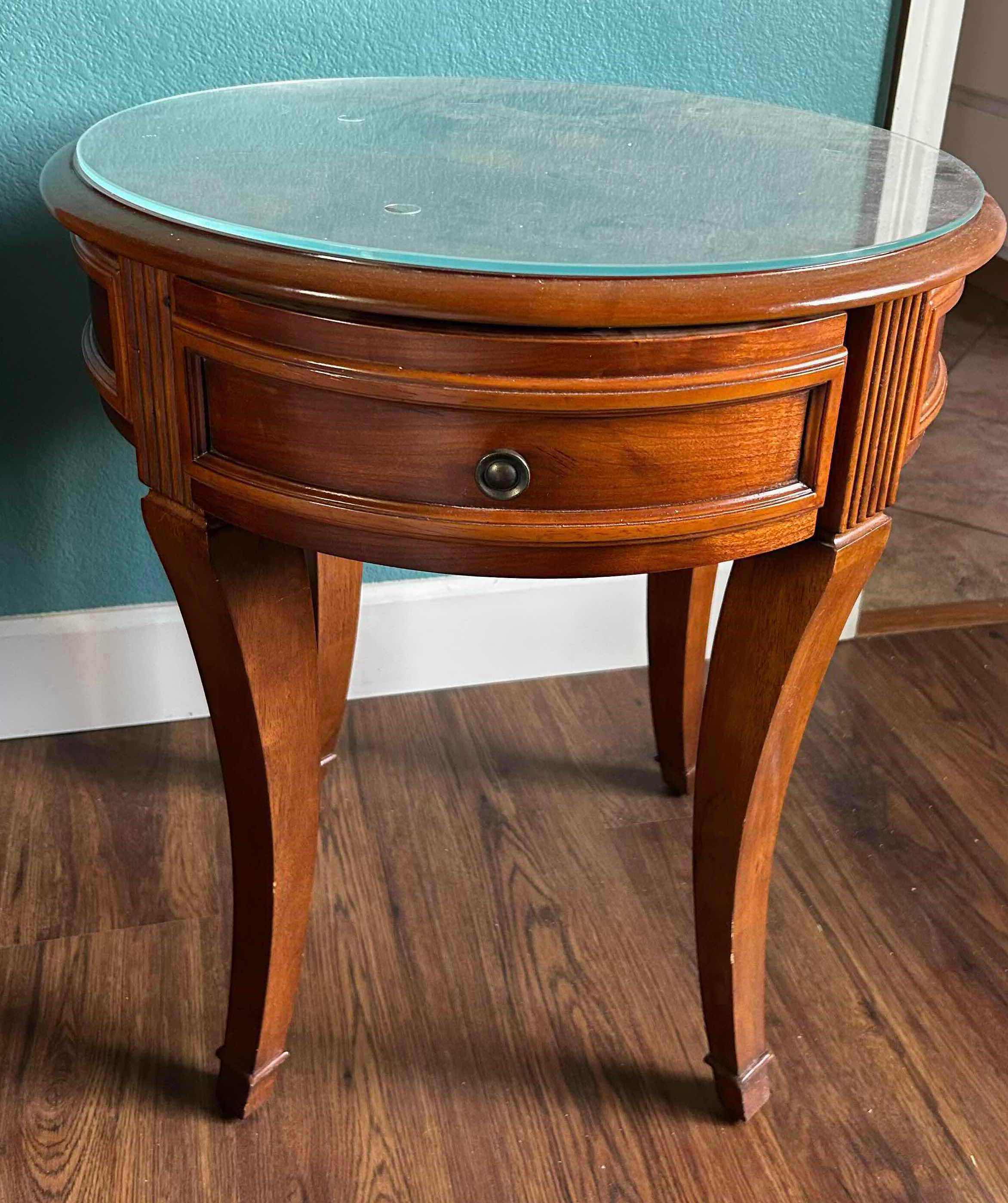 Photo 1 of ROUND GLASS TOP WOOD SIDE TABLE 23" X 27"