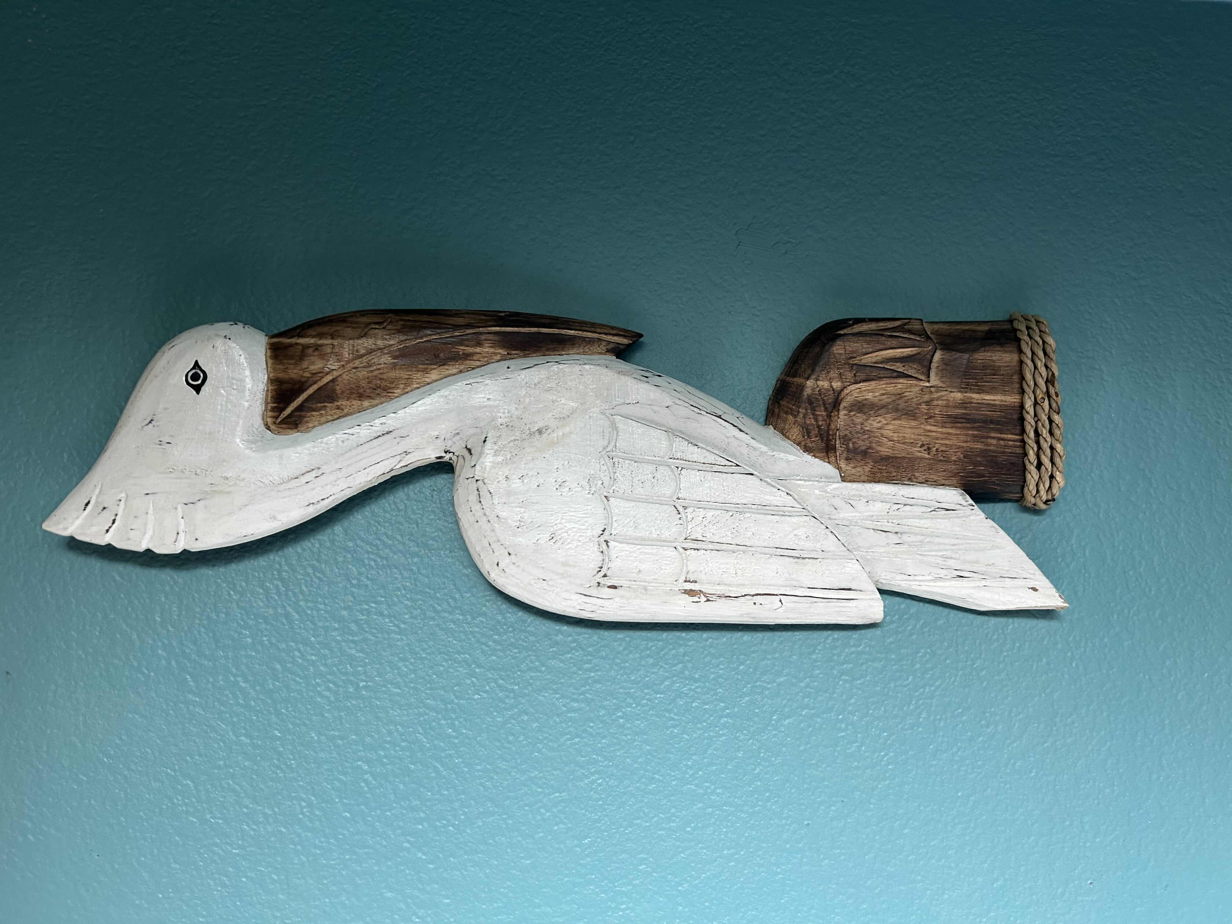 Photo 1 of WOODEN WALL SCULPTURE OF PELICAN PERCHED ON PILING H 23"